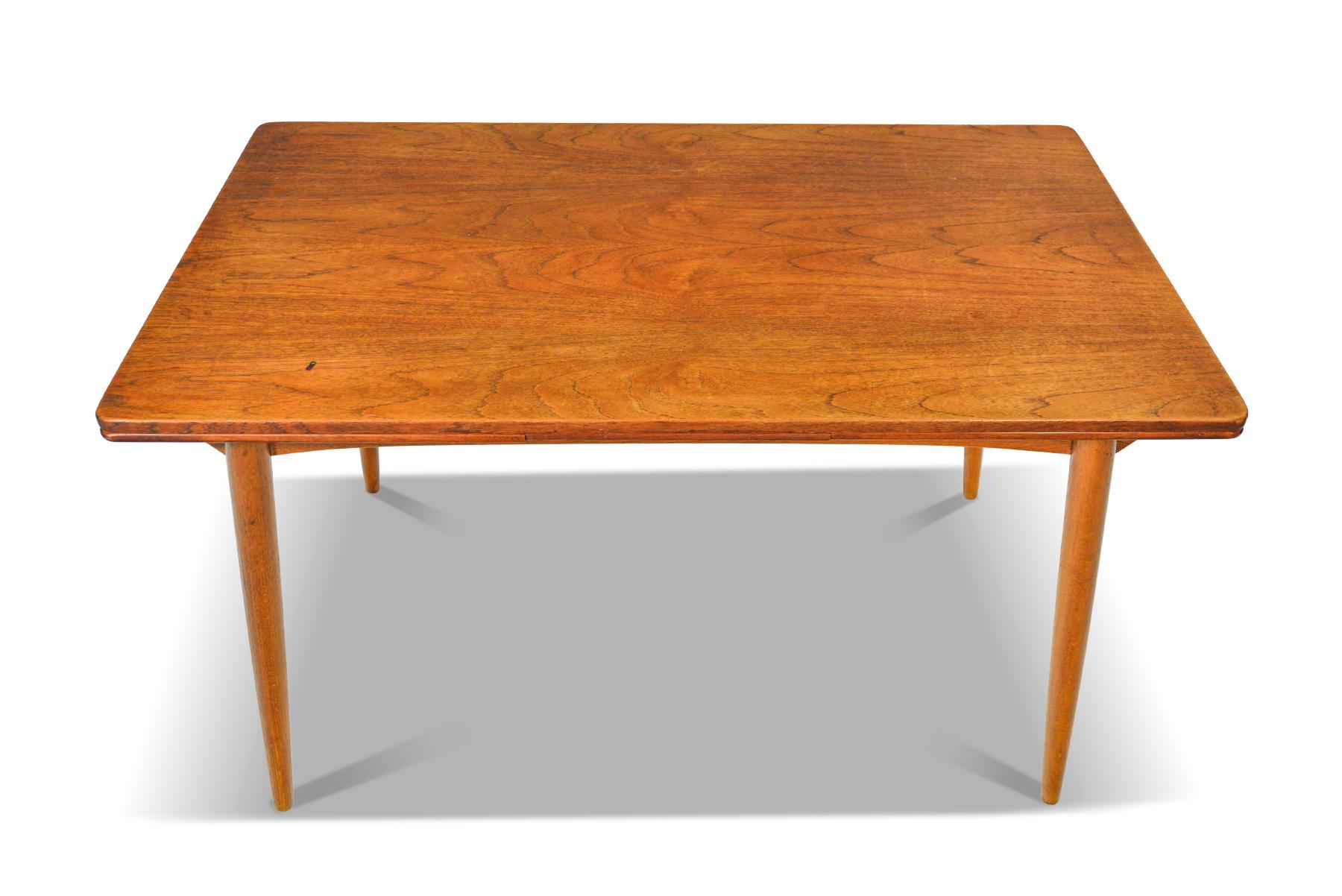 Origin: Denmark
Designer: Unknown
Manufacturer: Unknown
Era: 1960s
Materials: Teak
Measurements: 53 long x 33.5 wide x 29.5 tall
Expanded (both leaves): 92 long x 33.5 wide x 29.5 tall

Condition: In good original condition with some