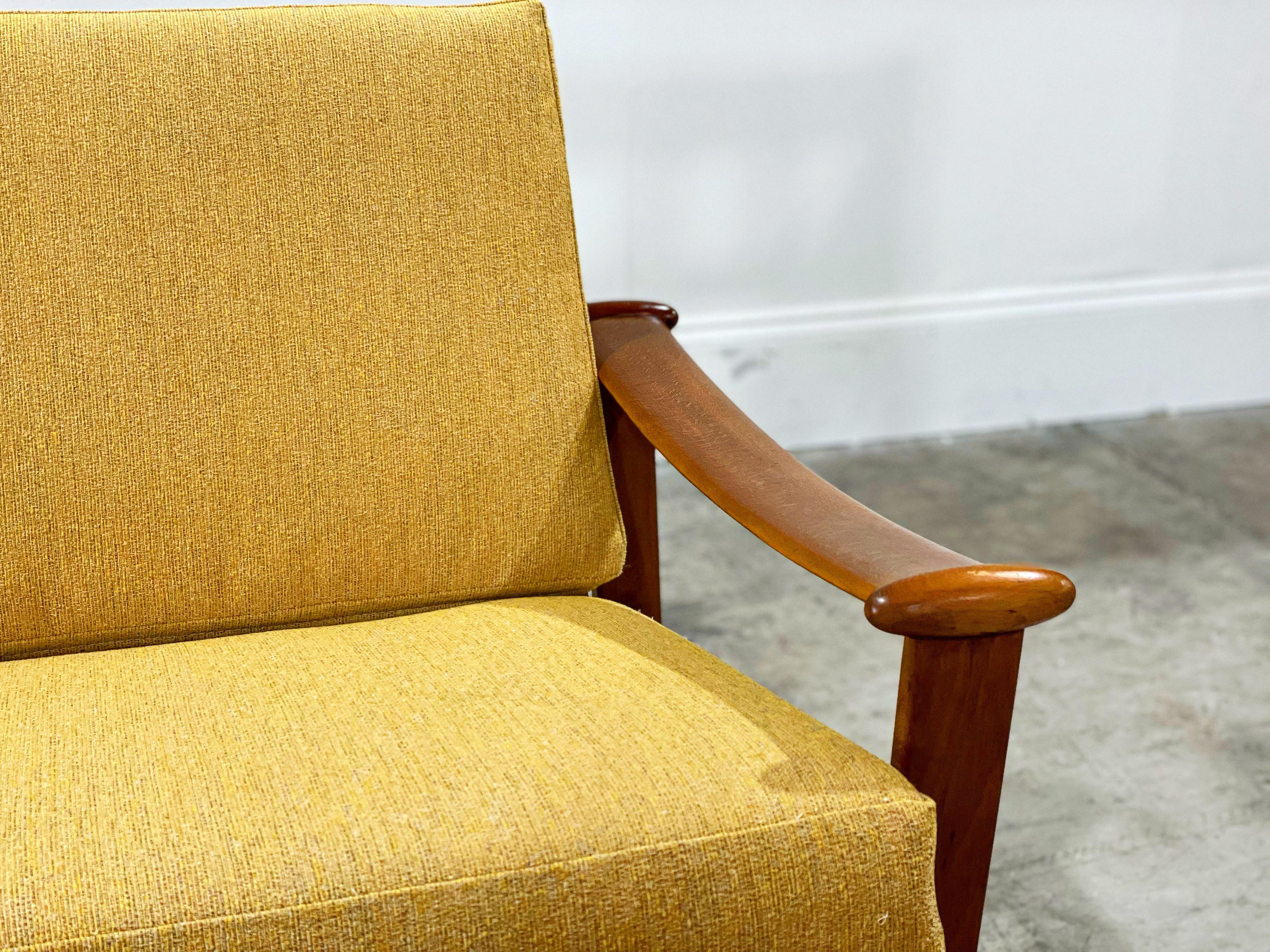 Midcentury Danish modern rocking chair by M. Nissen, Denmark circa 1960s. Sculptural carved teak 