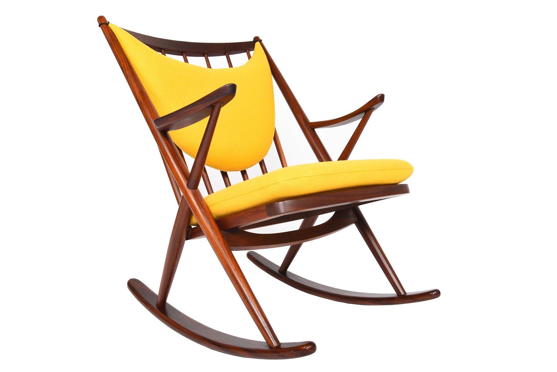 This Danish modern midcentury rocker is a fantastic find. Crafted in solid afromosia and designed by Frank Reenskaug for Bramin, this rocker affords a wide seat and smooth rocking action for hours of relaxation.  Recently recovered in canary yellow