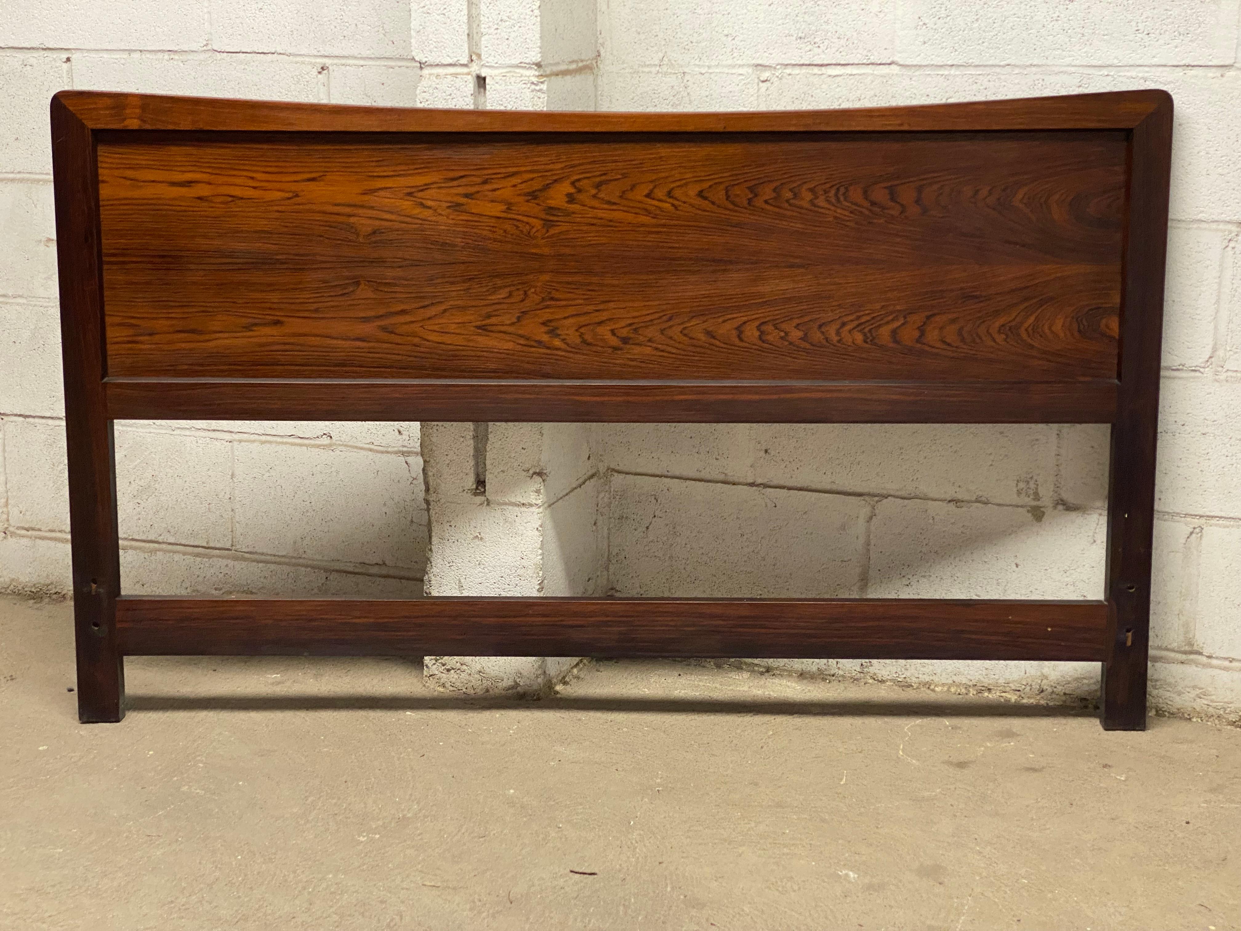 Danish modern rosewood and cane reversible full size headboard. Beautifully figured and complex veneers. Circa 1965. Good overall condition with wear commensurate with age and use. The cane mat is in good condition with some minor fraying around the