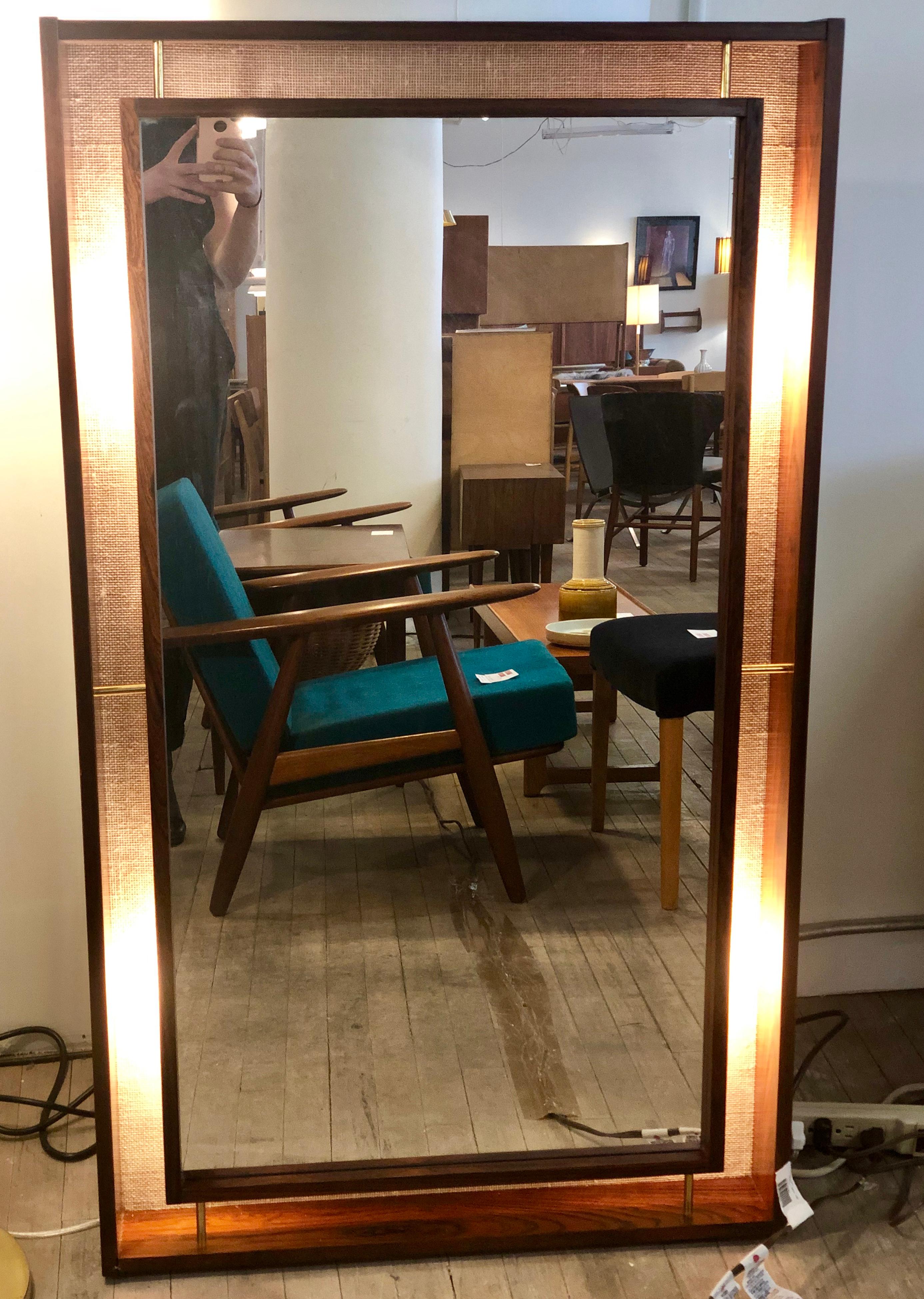 A sexy 1970s rosewood wall mirror with floating mirror in frame, a textured interior back, capable of emanating a soft light from behind the glass. Perfect piece for bedroom or moody lounge/study space.

Professional, skilled furniture restoration