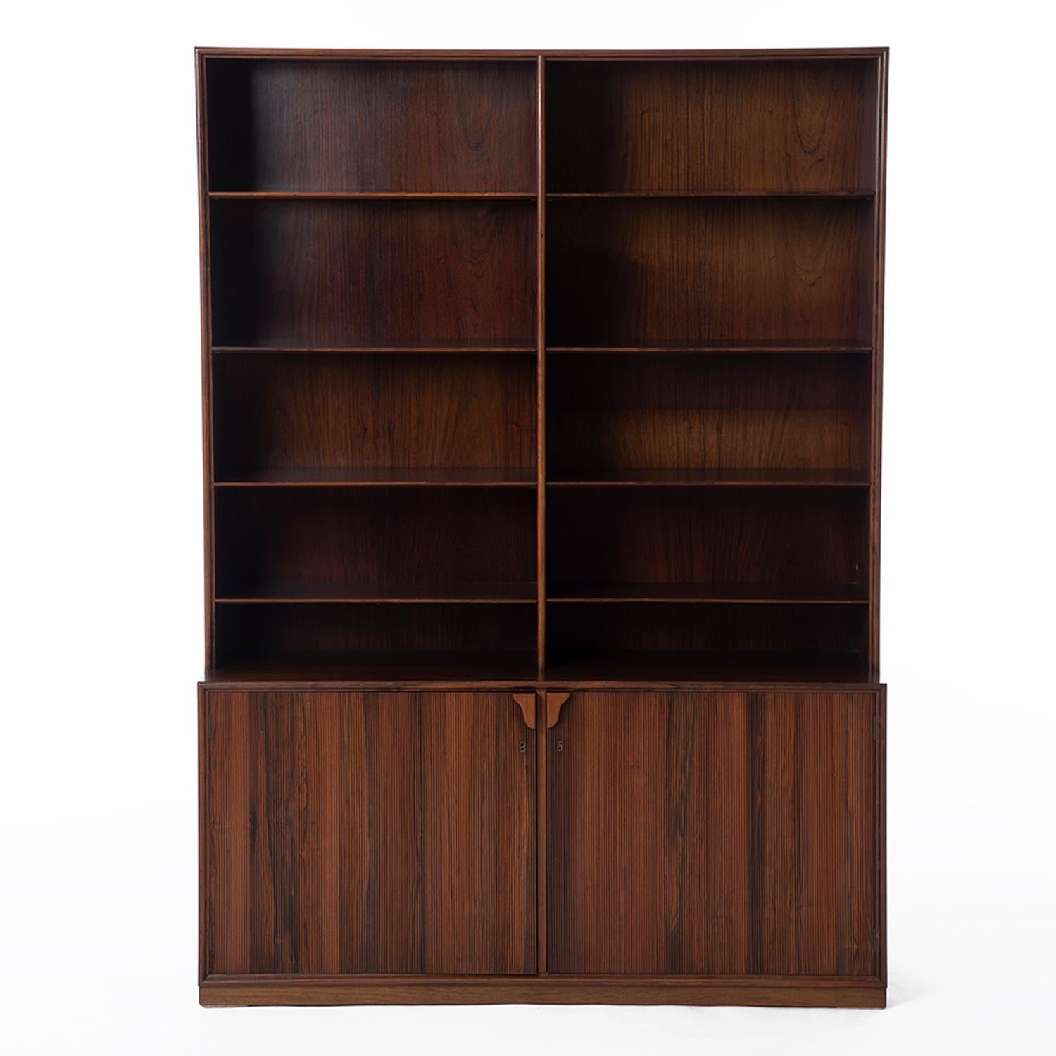 Danish modern rosewood bookcase. Adjustable shelving and lower cabinet. Design by Frode Holm.



Professional, skilled furniture restoration is an integral part of what we do every day. Our goal is to provide beautiful, functional furniture that