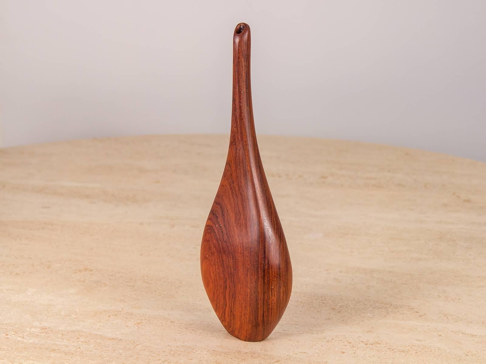 Elegantly sculpted Danish modern rosewood bud vase. 1.5” base delicately balances the curves of the pear shaped body up to the elongated neck. Gorgeous rosewood selection, with a very distinct grain. 1960s, unmarked.