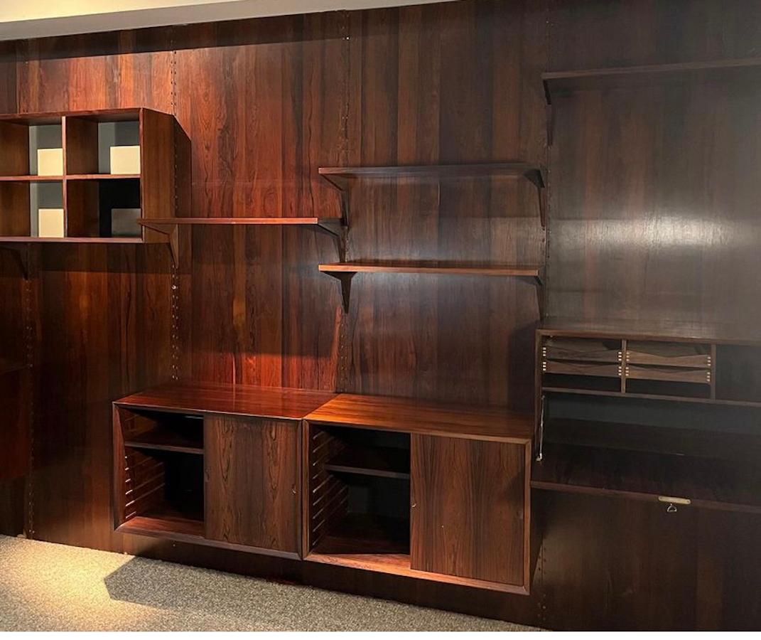 Mid-century Danish modern rosewood 'cado' unit / system by Poul Cadovius shows minimal wear due to being in one home. There is a variety of installation options as the shelving and compartment components can be interchanged and placed according to