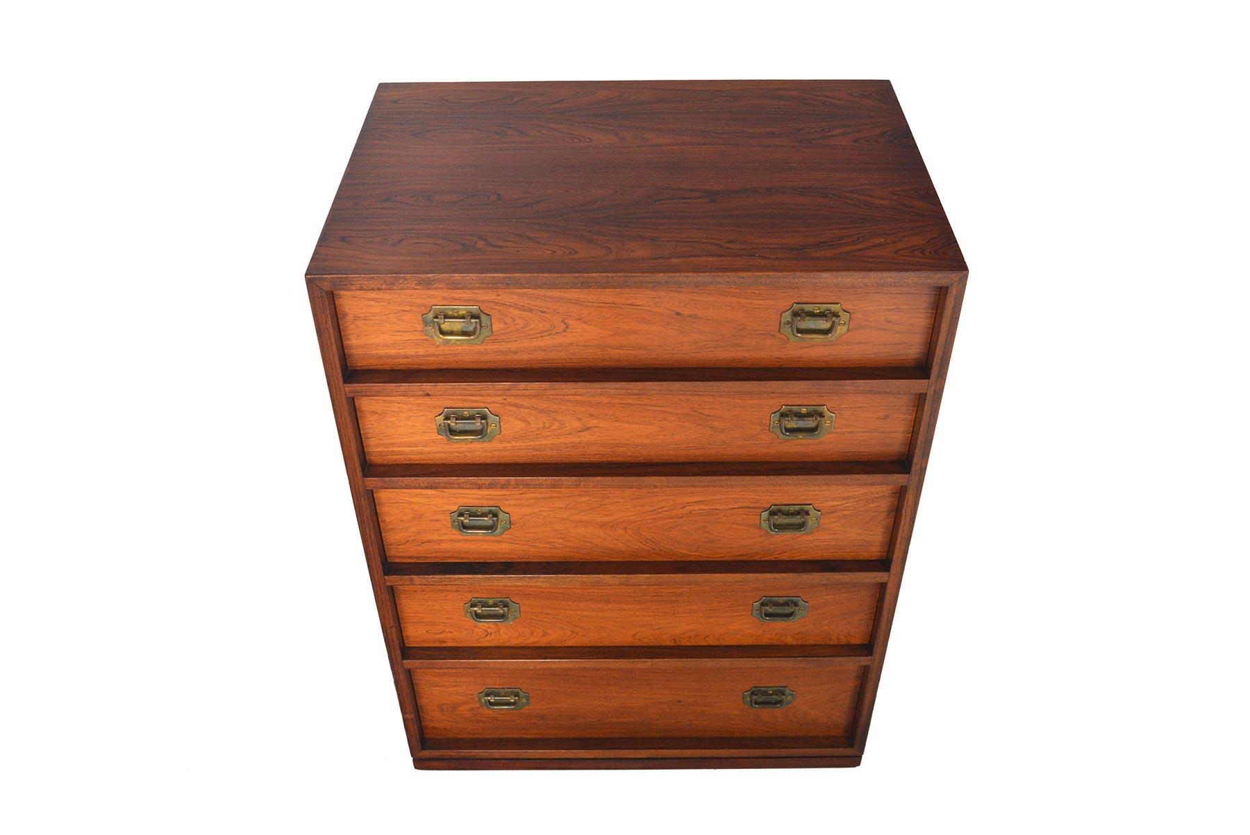 This Danish modern midcentury Brazilian rosewood jewelry chest was designed by Henning Korch for Silkeborge Møbelfabrik in the late 1960s. Beautifully detailed in the “Campaign” style, this small chest offers five drawers with brass drop- ring