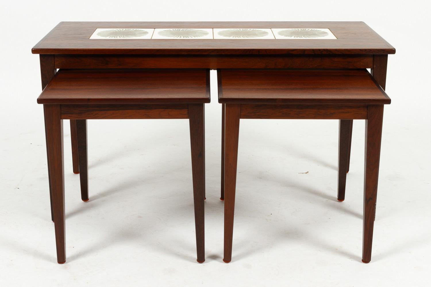 Danish Modern Rosewood & Ceramic Tile Nesting Tables, 1960s, Set of 3.
Set of three rosewood nesting tables by Kvalitet, Form & Funktion, Denmark. One large table, and two identical smaller tables that fit under the large one. The large table
