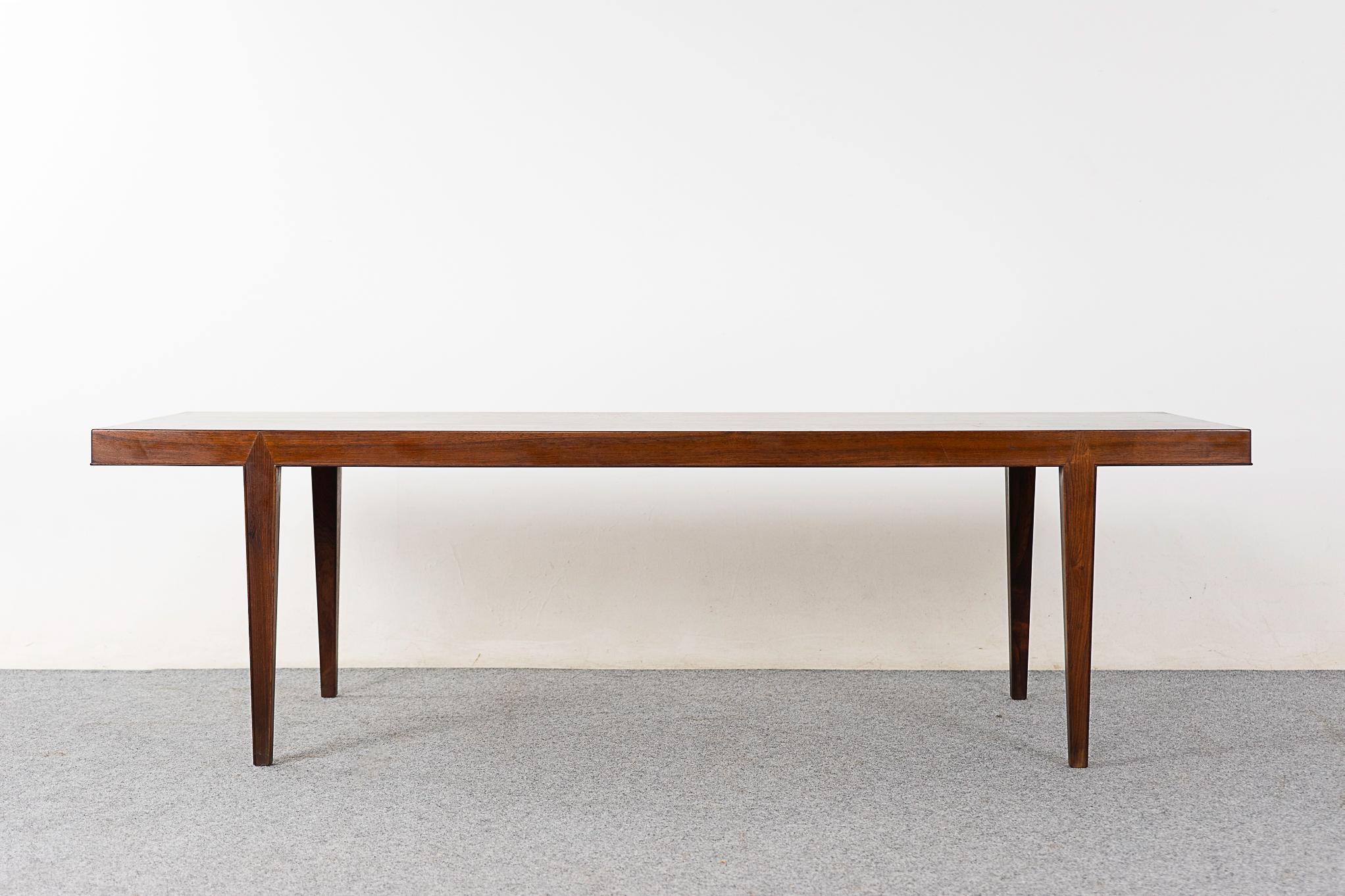 Rosewood mid-century coffee table designed by Severin Hansen for Haslev, circa 1960's. Beautiful book matched veneer on the top surface, slick geometric corner joinery.

Please inquire for remote and international shipping rates.