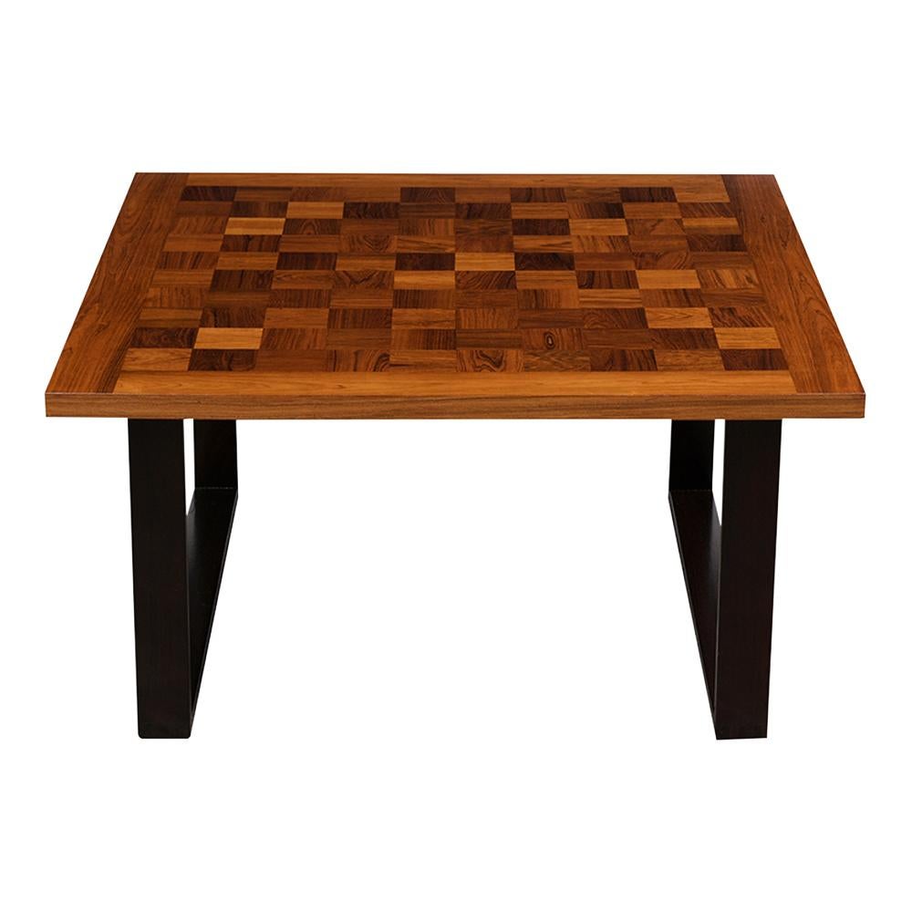 This Vintage Danish Checkered Top Coffee Table is made out of rosewood, mahogany, and been fully restored. The table features an inlay chess design, its original stained finish, and has been waxed and polished to create a beautiful patina. The