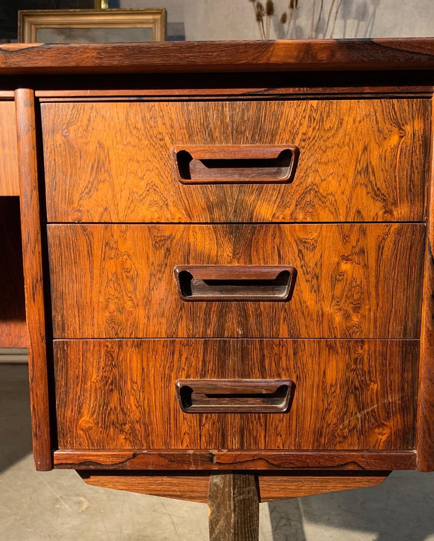 Strong rosewood in this Danish piece maker currently not confirmed. Locking drawers and front compartment.