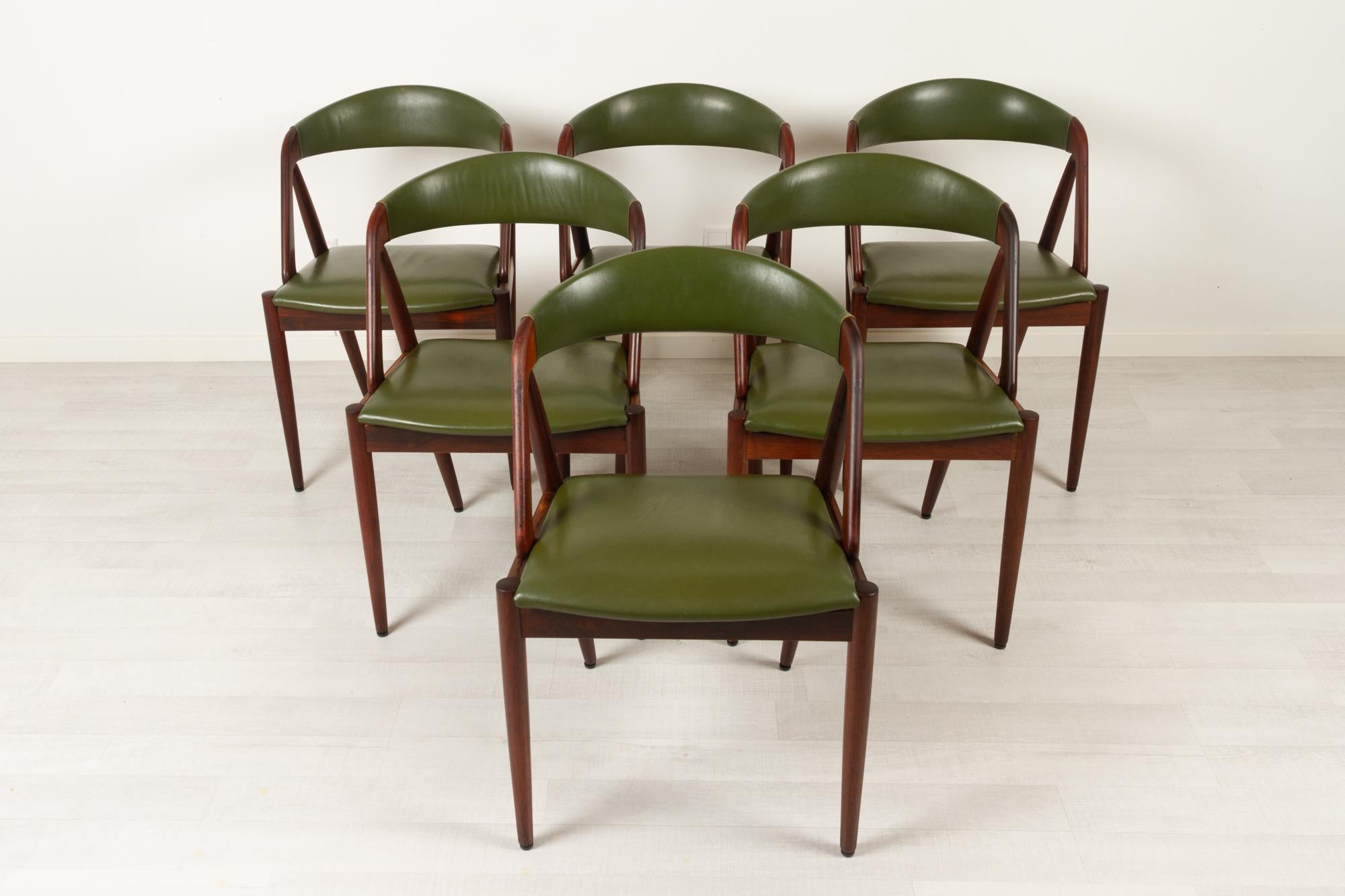 Danish modern rosewood dining chairs model 31 by Kai Kristiansen for Schou Andersen, Denmark 1960s, Set of 6
Set of Danish Mid-Century Modern dining room chairs in solid Rosewood. Upholstered with beautiful original green leather which is very rare