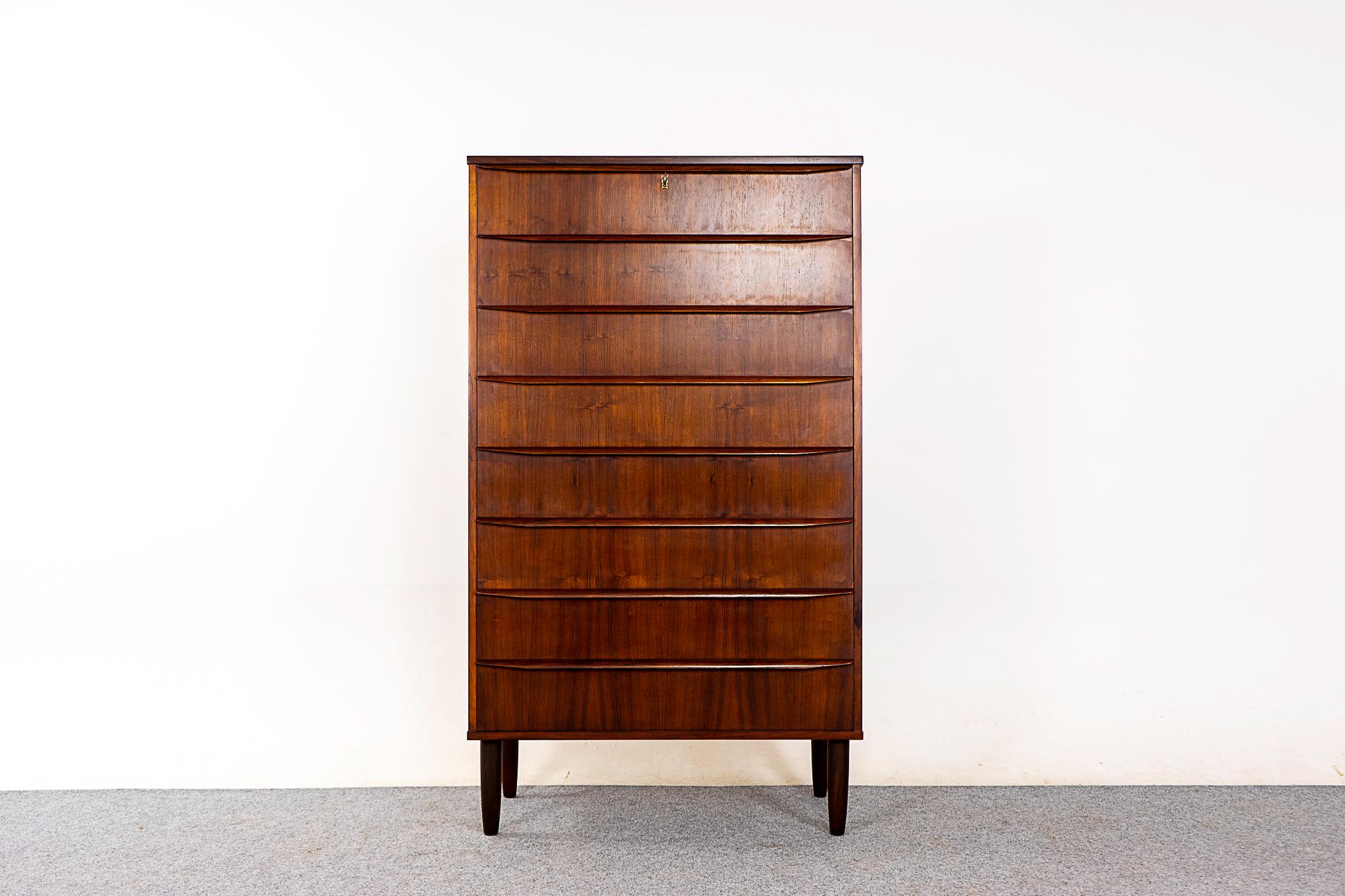 Rosewood mid-century highboy dresser, circa 1960's. Integrated horizontal drawer, solid wood edging and stunning book-matched veneer. Very unique 8 drawer model.