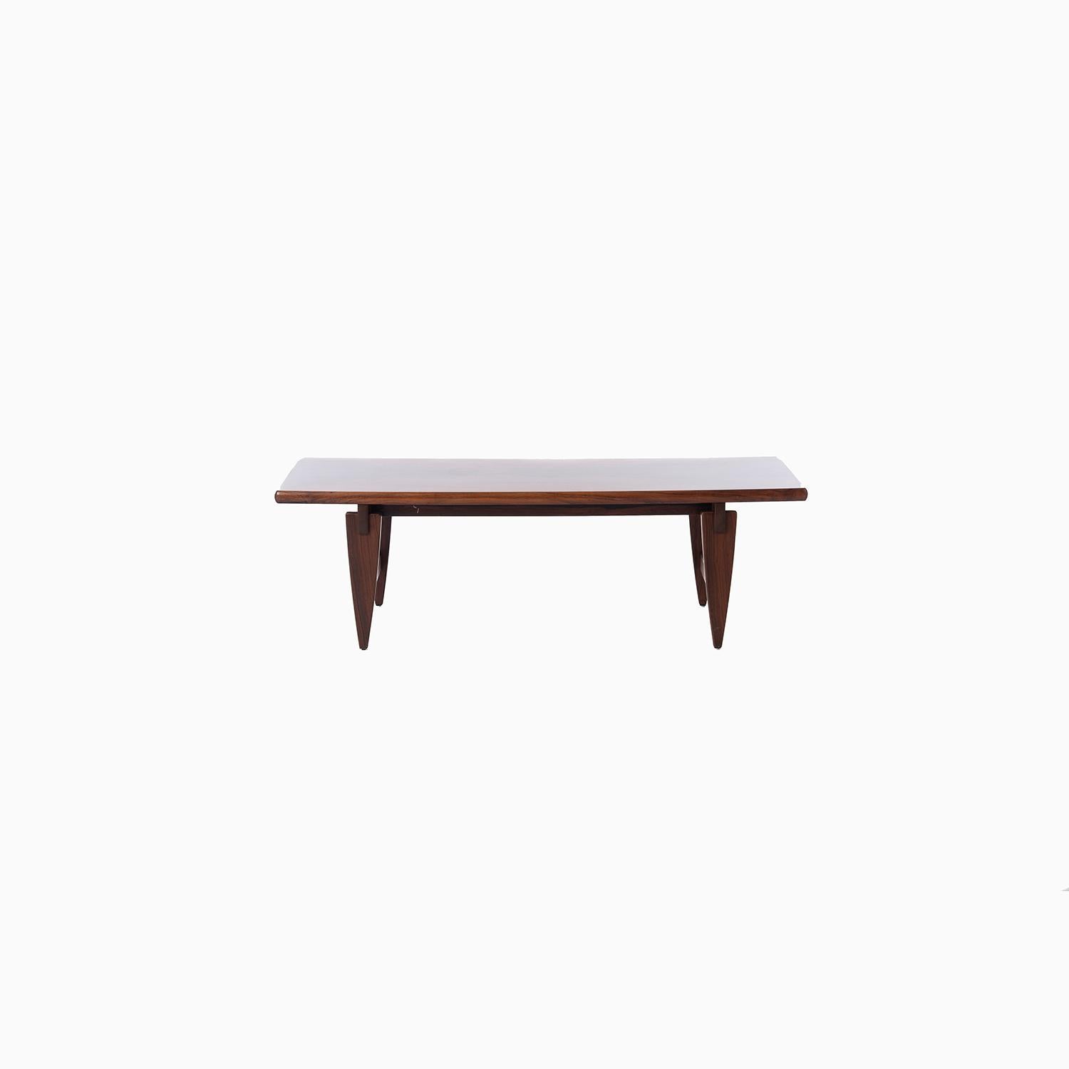 Large scale Brazilian rosewood coffee table designed by Illum Wikkelsø.


Professional, skilled furniture restoration is an integral part of what we do every day. Our goal 
is to provide beautiful, functional furniture that honors its