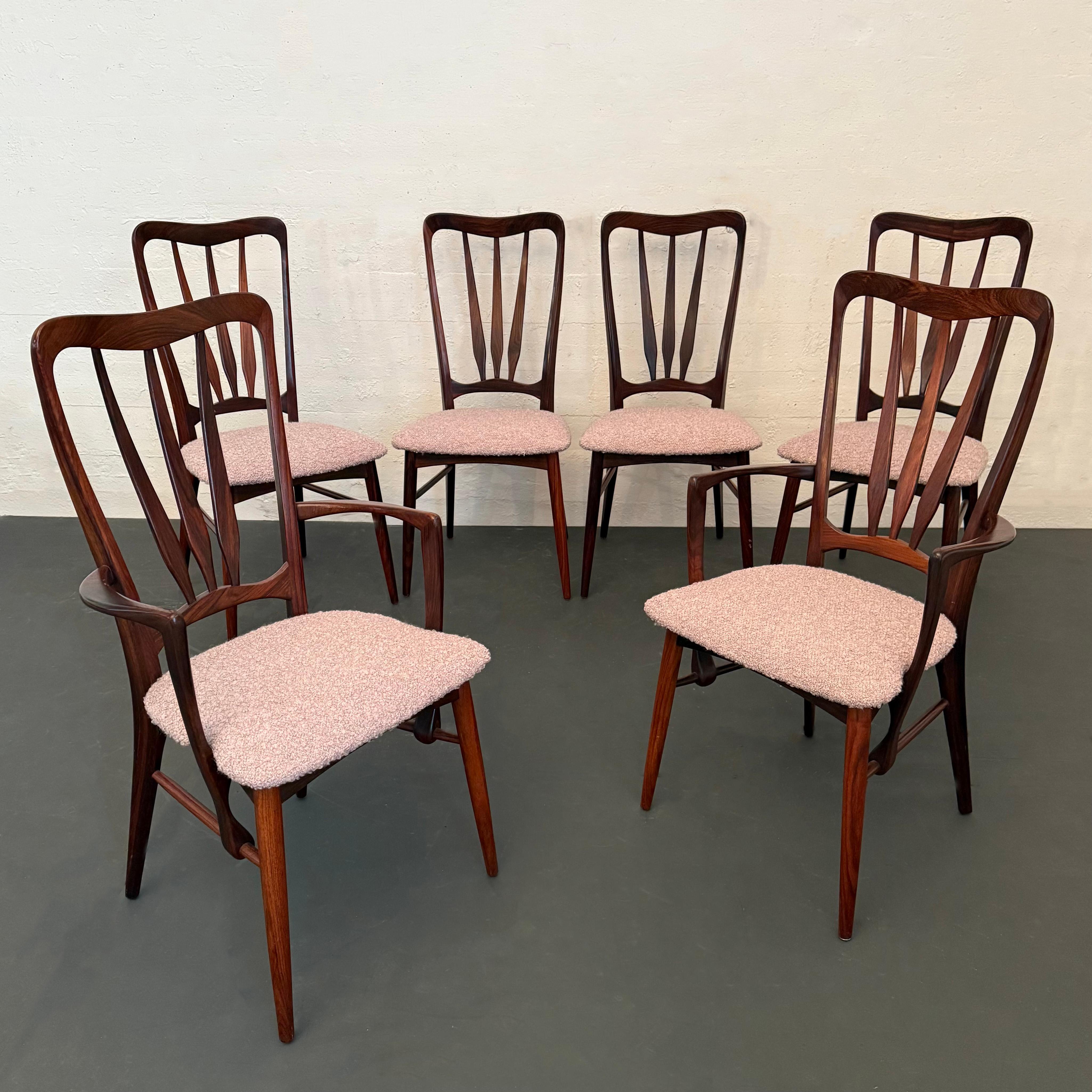 Set of six, Danish modern, rosewood, “Ingrid” dining chairs by Niels Koefoed for Koefoeds Hornslet consists of four side chairs and two captain armchairs. The curvaceous frames feature high backs with a deep rosewood grain throughout and outstanding