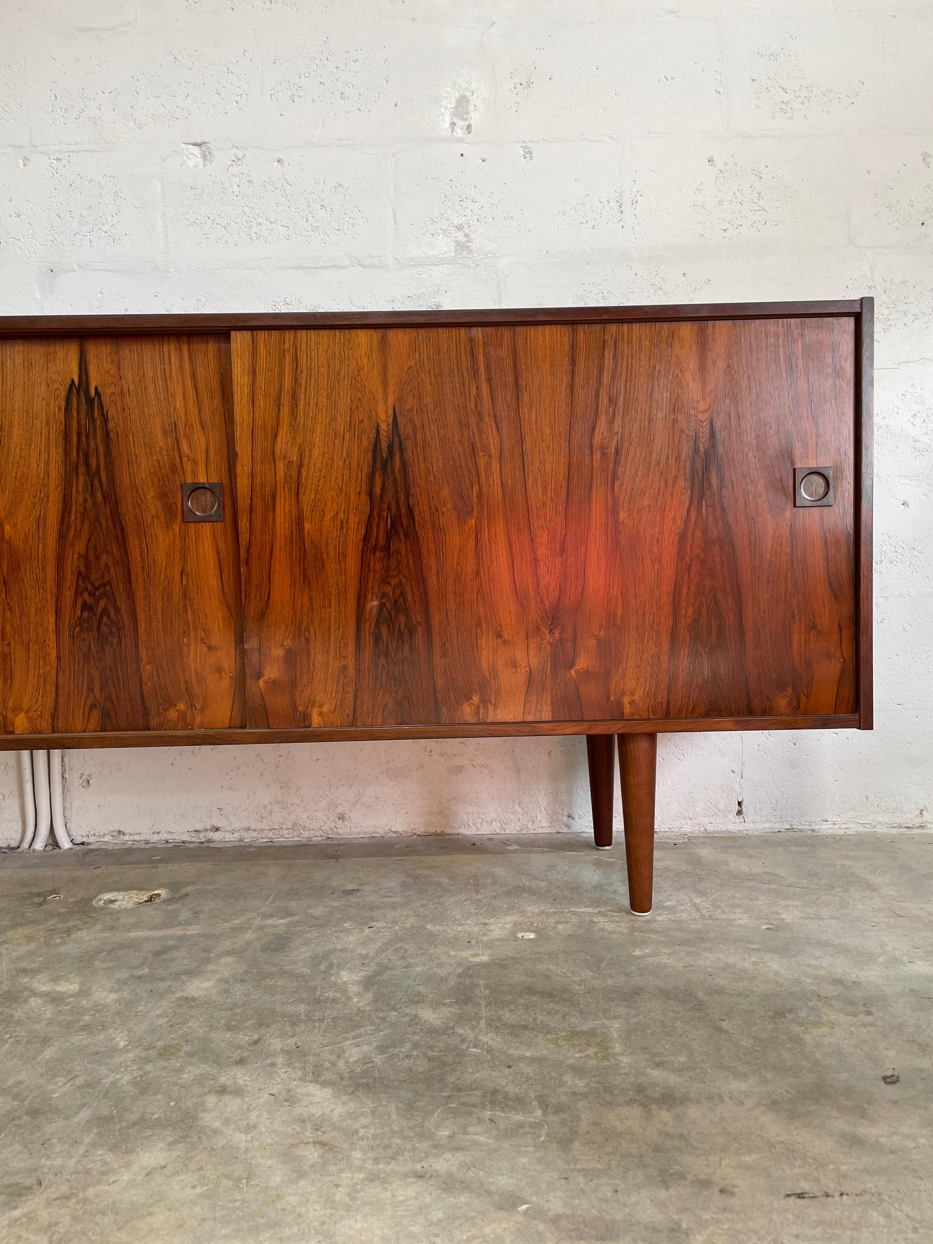 Long Danish Modern Credenza or Console. Shelves and drawers behind doors. 95.25w 16.25d 32h