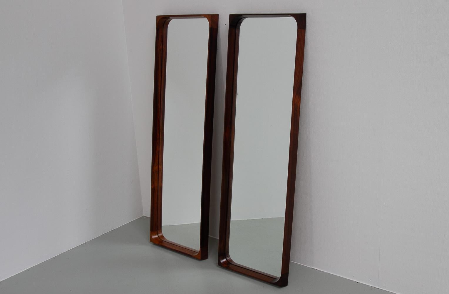 Danish Modern Rosewood Mirrors by Niels Clausen for NC Møbler, 1960s. Set of 2.
Pair of large Rosewood/Palisander wall mirrors designed by Danish master carpenter Niels Clausen for N.C. Møbler, Odense, Denmark. 
Frame in solid Rosewood with rounded