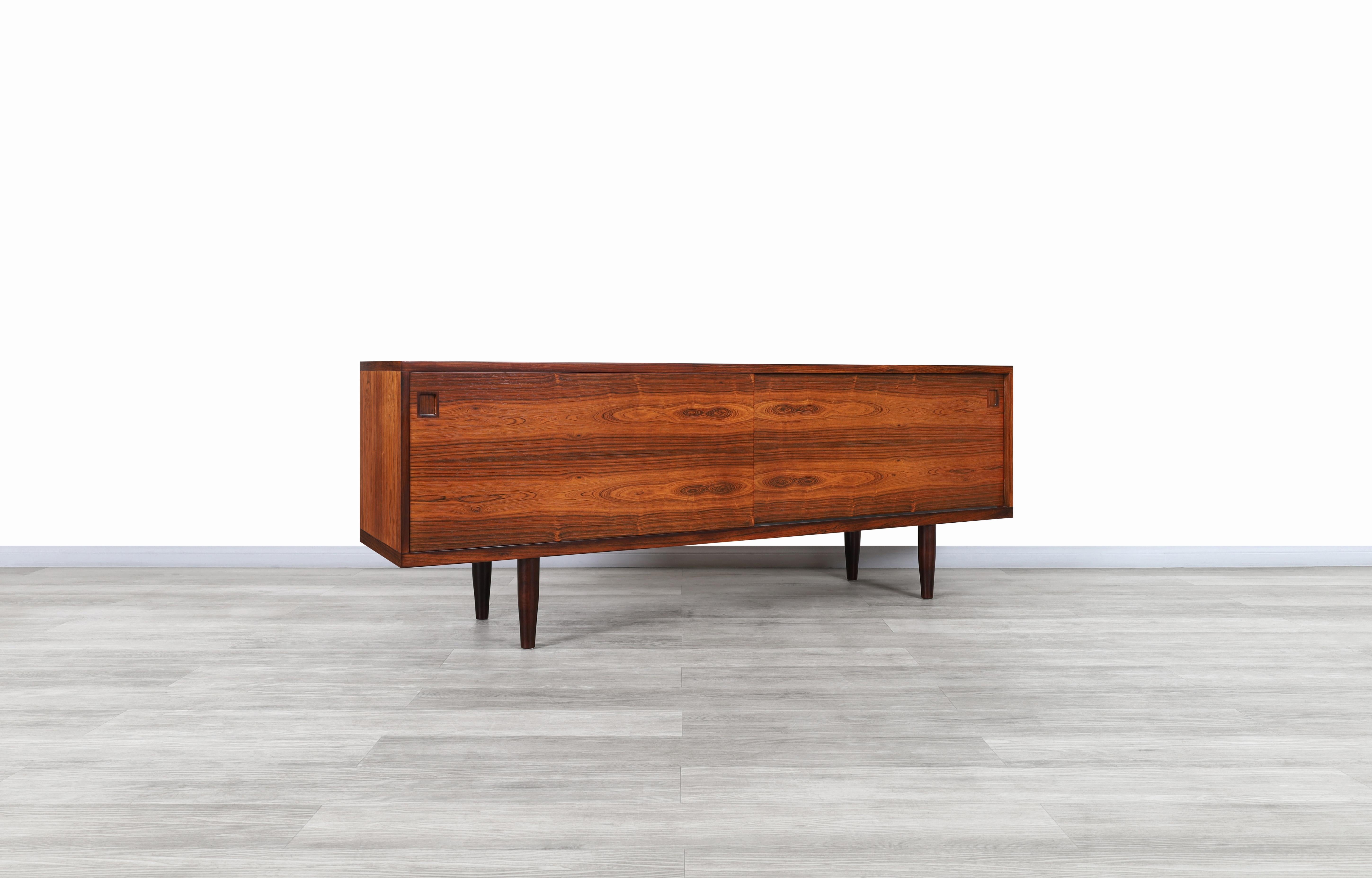 Stunning Danish Brazilian rosewood credenza designed by Niels O. Moller for J.L. Møller Møbelfabrik, circa 1950s. This rare credenza corresponds to model #20 from a unique collection by designer Niels O. Møller, highlighting the design and fine