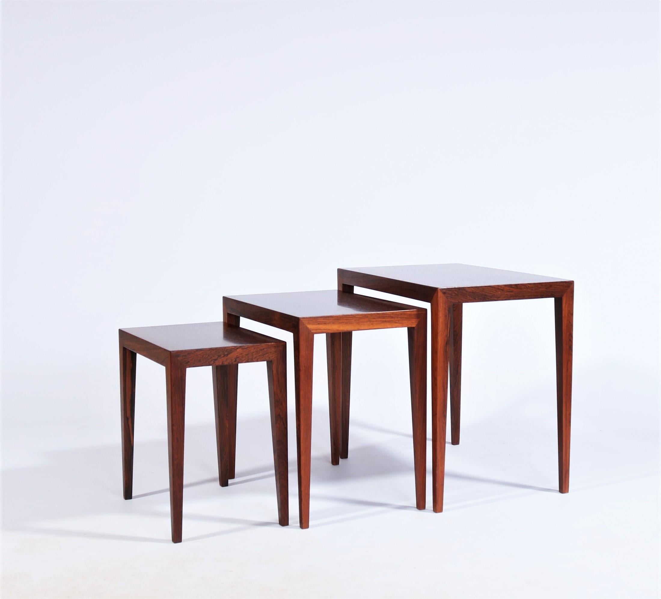 Simplistic and sophisticated set of nesting tables in beautifully grained rosewood designed by Severin Hansen Jr. for Haslev Møbelsnedskeri, Denmark, 1950s. The tables are made from beautifully grained rosewood veneer and the design is simply