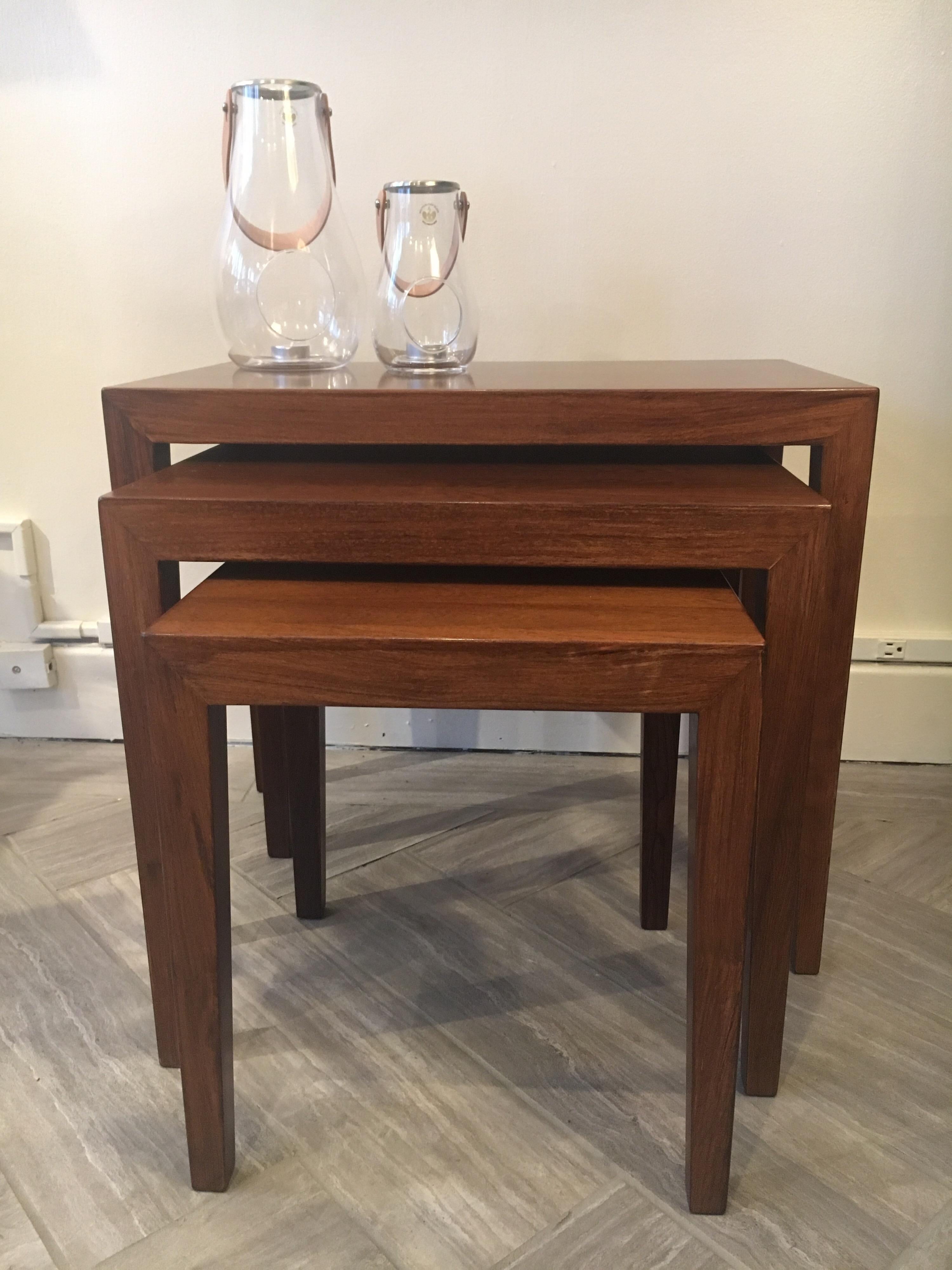 Wonderful set of 3 Danish Modern rosewood nesting tables by Haslev Moebel Fabrik, model 163. Versatile and chic, with beautiful lustre and patina. Perfect as side tables, end tables, or coffee tables to add that Mid Century Modern look with beauty