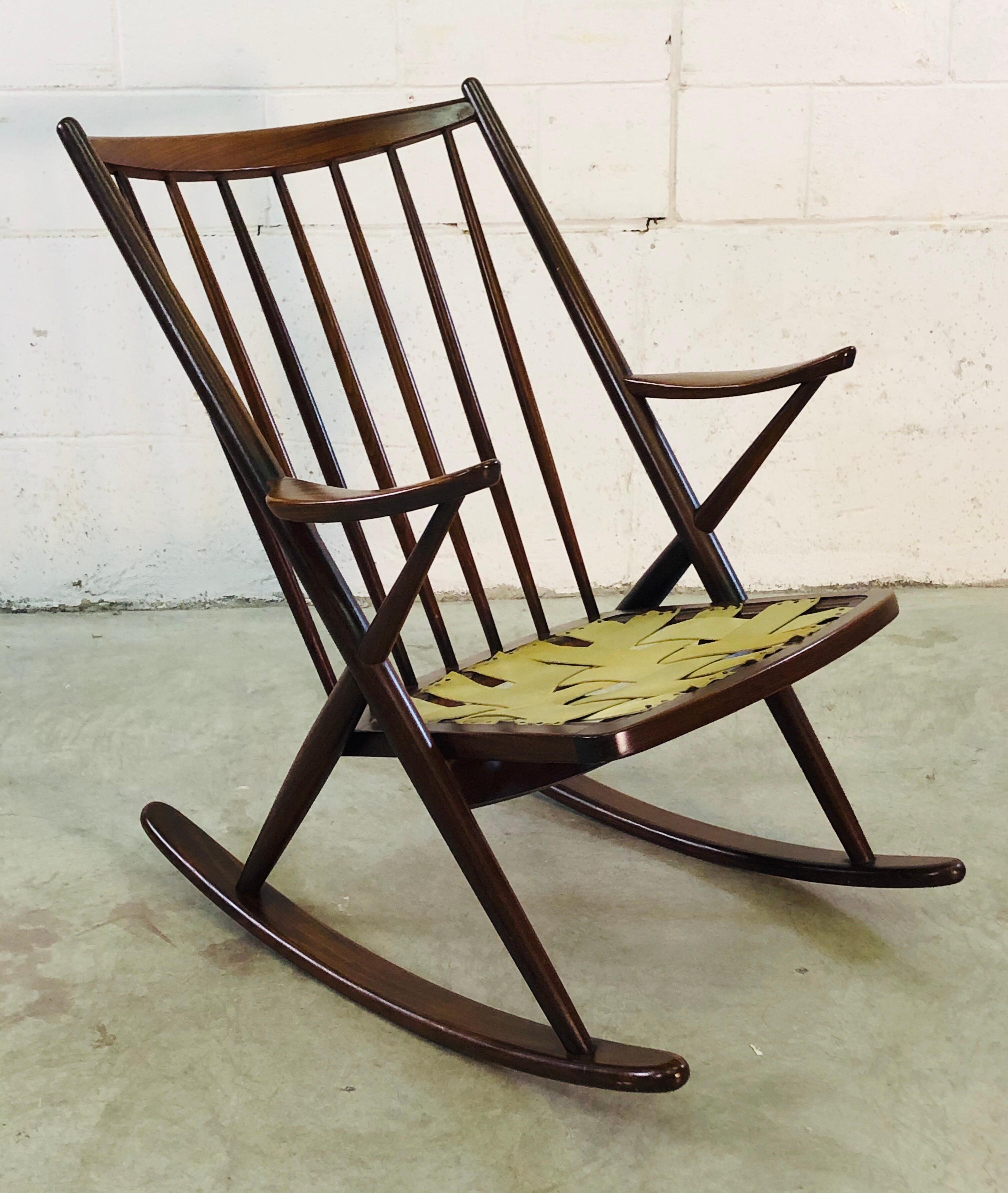 Vintage Danish modern rosewood rocking chair designed by Frank Reenskaug for Brahmin Mobler, 1960s. Well designed and extremely comfortable rocking chair is sturdy and in excellent condition. Cushions need replacement. No marks.