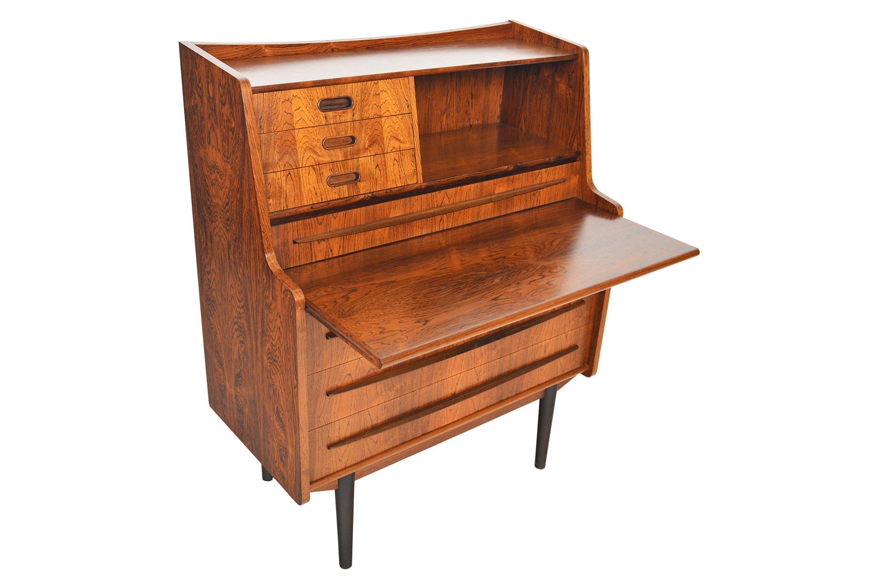 This incredible Danish modern rosewood vanity secretary desk hails straight from the 1960s! Manufactured by Gunnar Falsigs, this fantastic piece features a pull out vanity with original robin’s egg blue interior. Beneath the vanity is a pull out