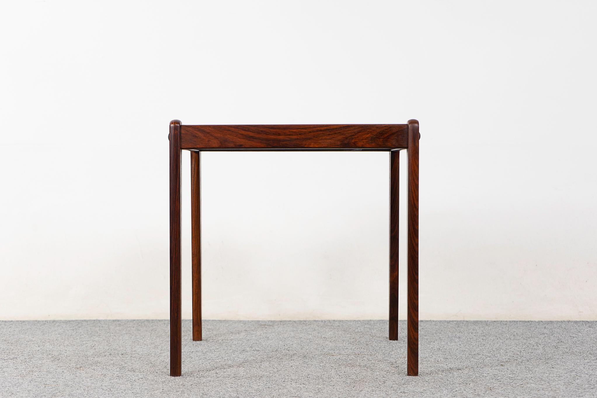 Rosewood mid-century side table by Spottrup, circa 1960's. Solid wood construction on the base and handsome book-matched veneer on the top. Use as a bedside, or end table! 

Unrestored item, some marks consistent with age.