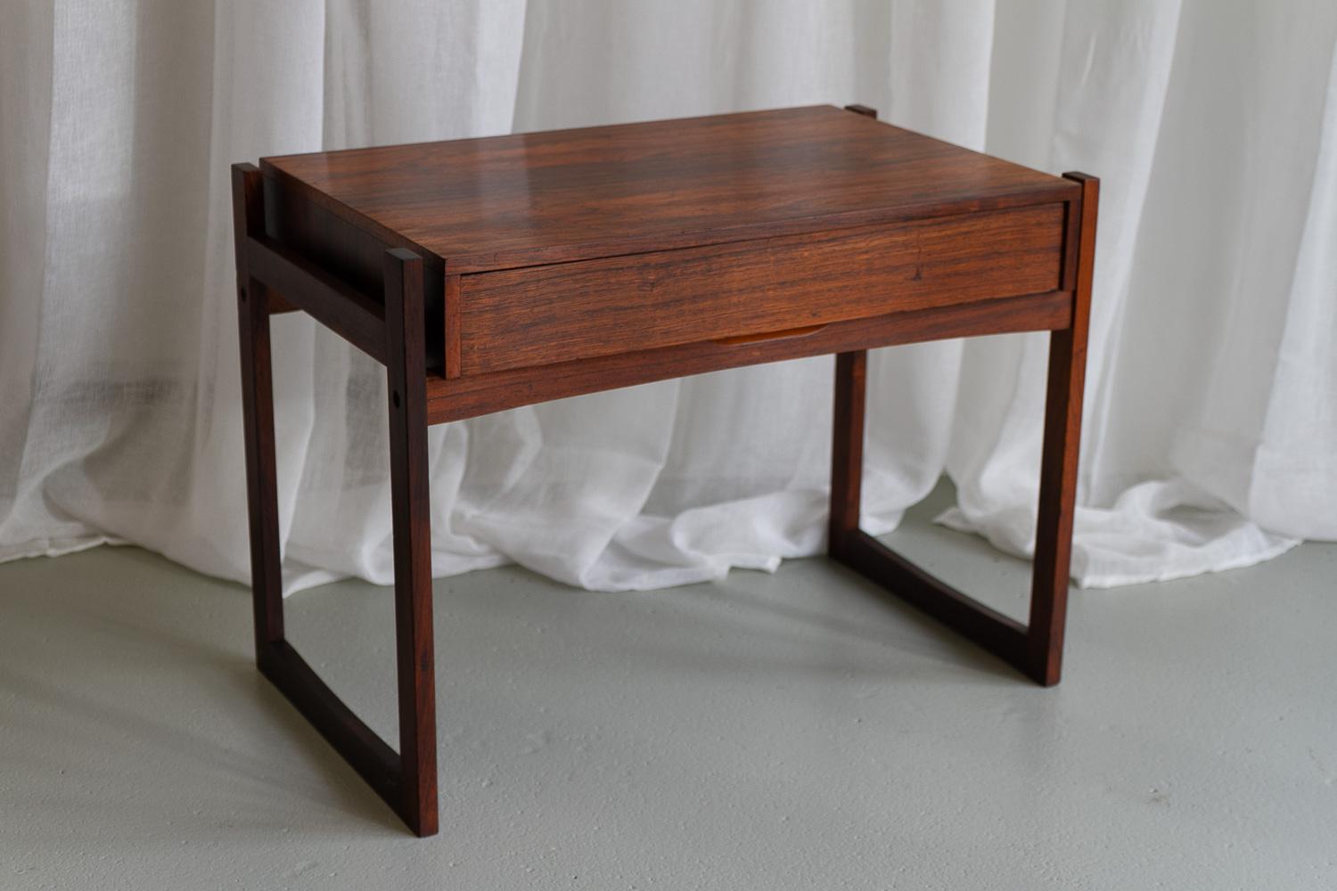 Danish Modern Rosewood Side Table with Drawer, 1960s.
Elegant and versatile Scandinavian Mid-Century Modern side table with sleigh legs and drawer. Drawer front sits flush with the edge and is thus concealed. This adds to the sleek and elegant