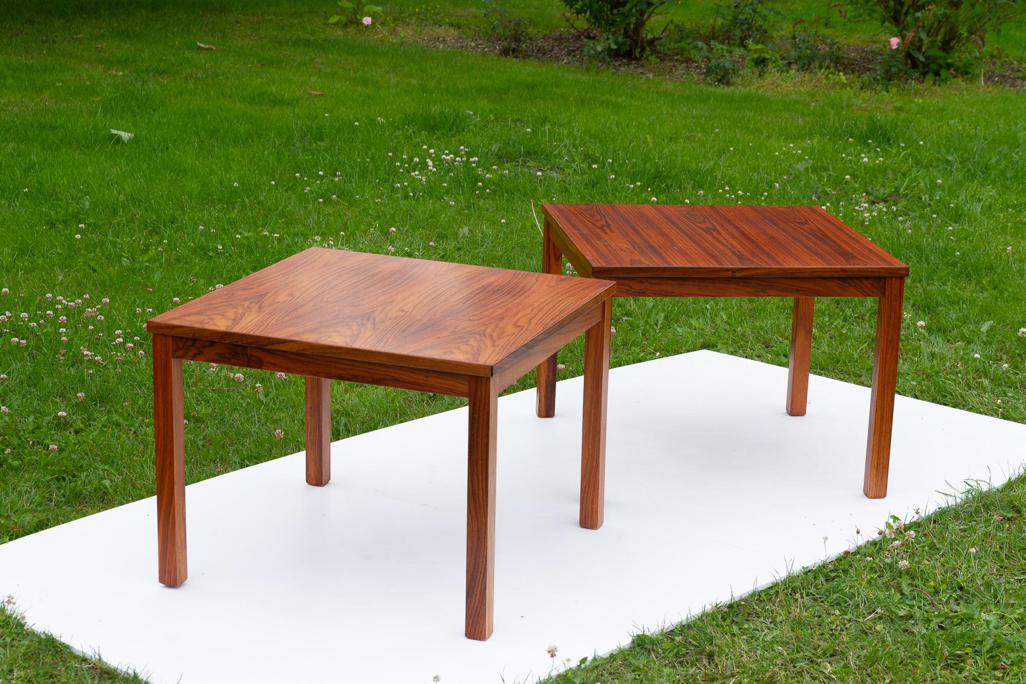 Danish Modern rosewood side tables, 1960s, set of 2. 
Pair of two matching tables in beautiful rosewood veneer. Square top with rectangular legs. Made in Denmark. 
Suitable as end tables, bedside tables or coffee tables.

Legs can be removed for