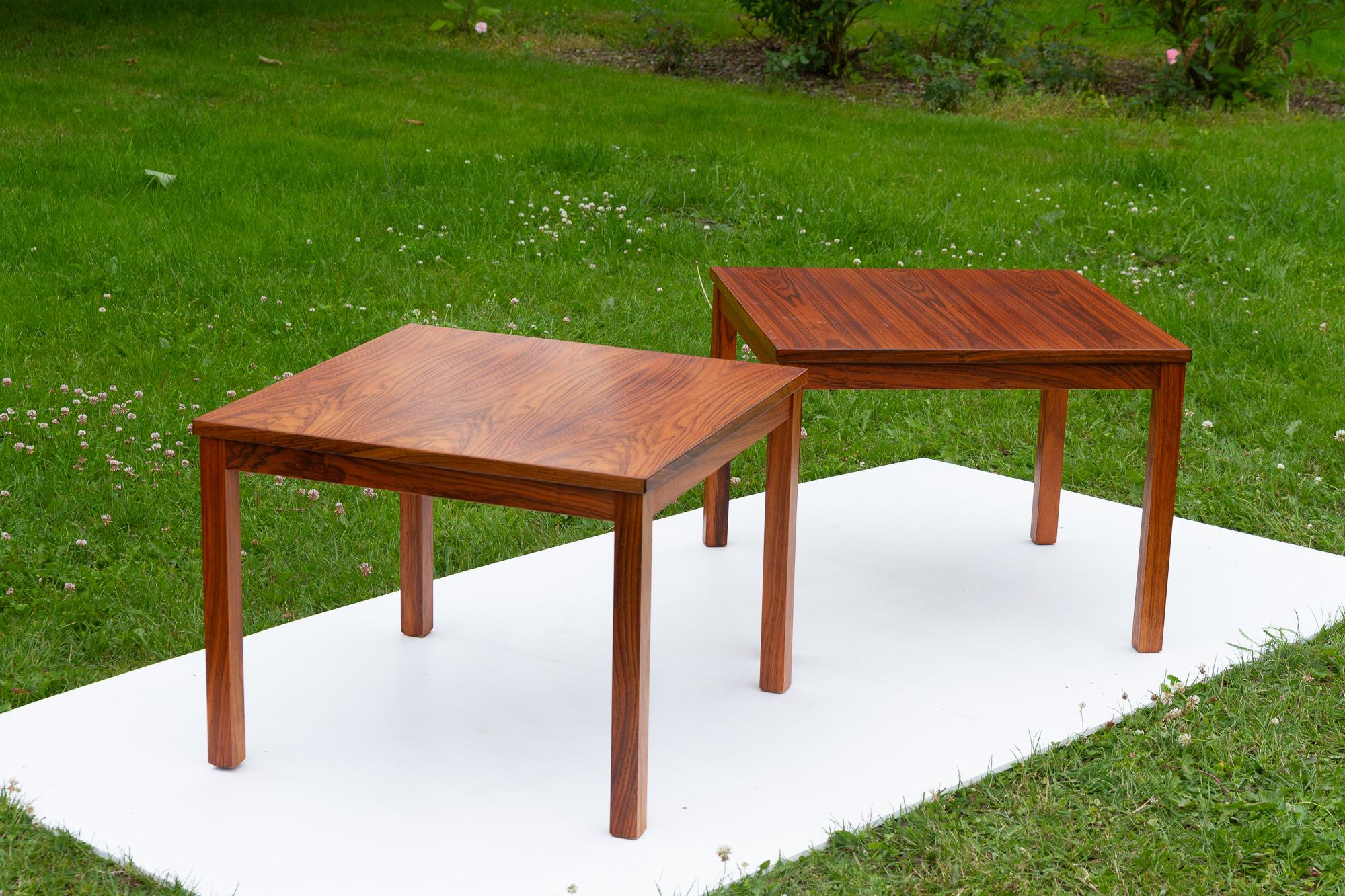 Danish Modern rosewood side tables, 1960s, set of 2. 
Pair of two matching tables in beautiful rosewood veneer. Square top with rectangular legs. Made in Denmark. 
Suitable as end tables, bedside tables or coffee tables.

Legs can be removed for