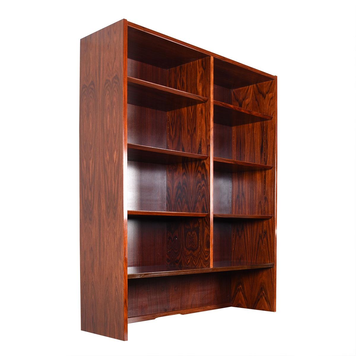 A Danish Modern rosewood bookcase / display top to store your precious items in minimalist splendor. This piece can also be placed atop another storage piece such as a sideboard. Shelves have beveled edges and are adjustable.

*Due to time, labor