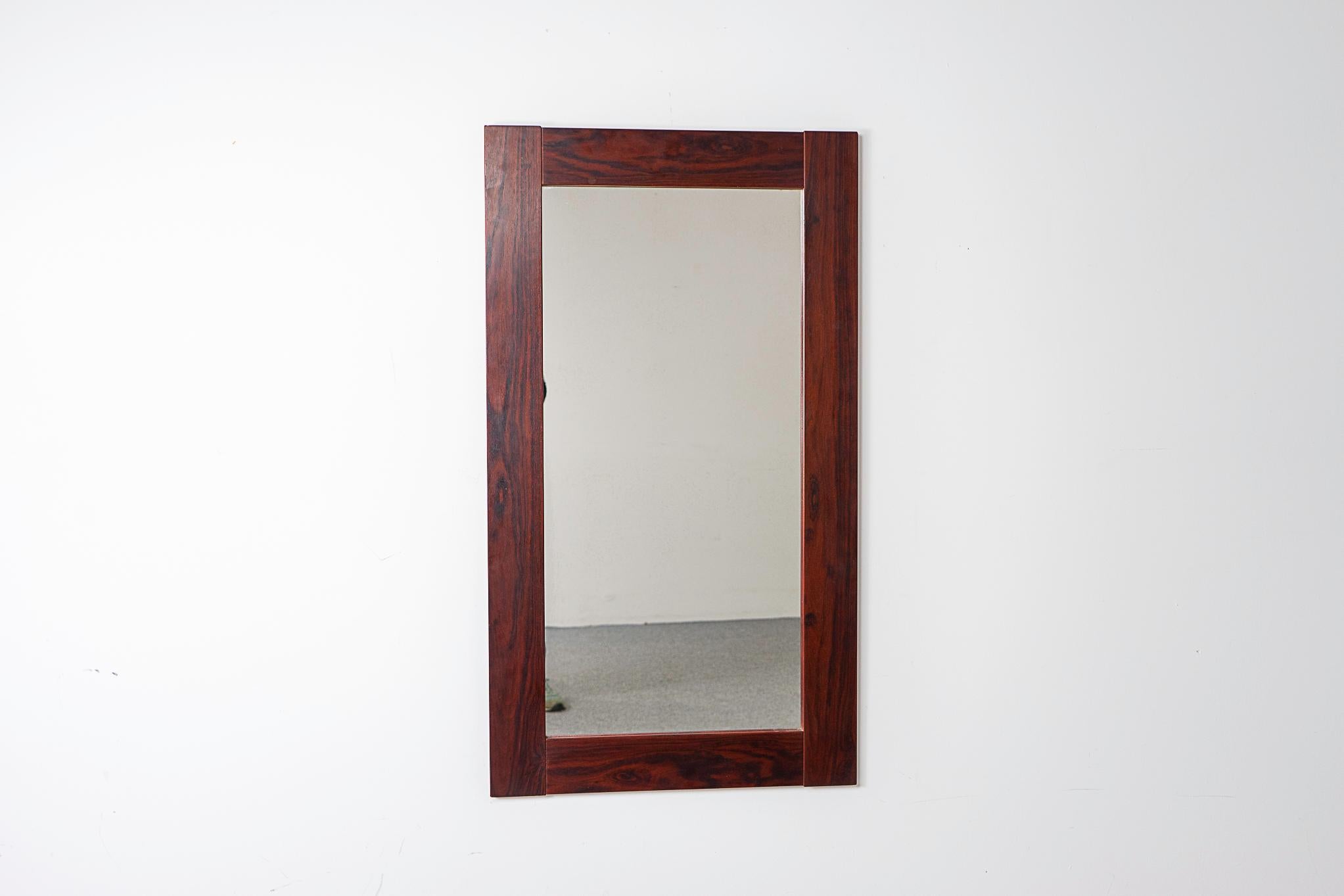 Rosewood Danish mirror, circa 1960's. The perfect compliment to any interior especially in small apartments, condos and lofts where space can be tight.

Please inquire for remote and international shipping rates.