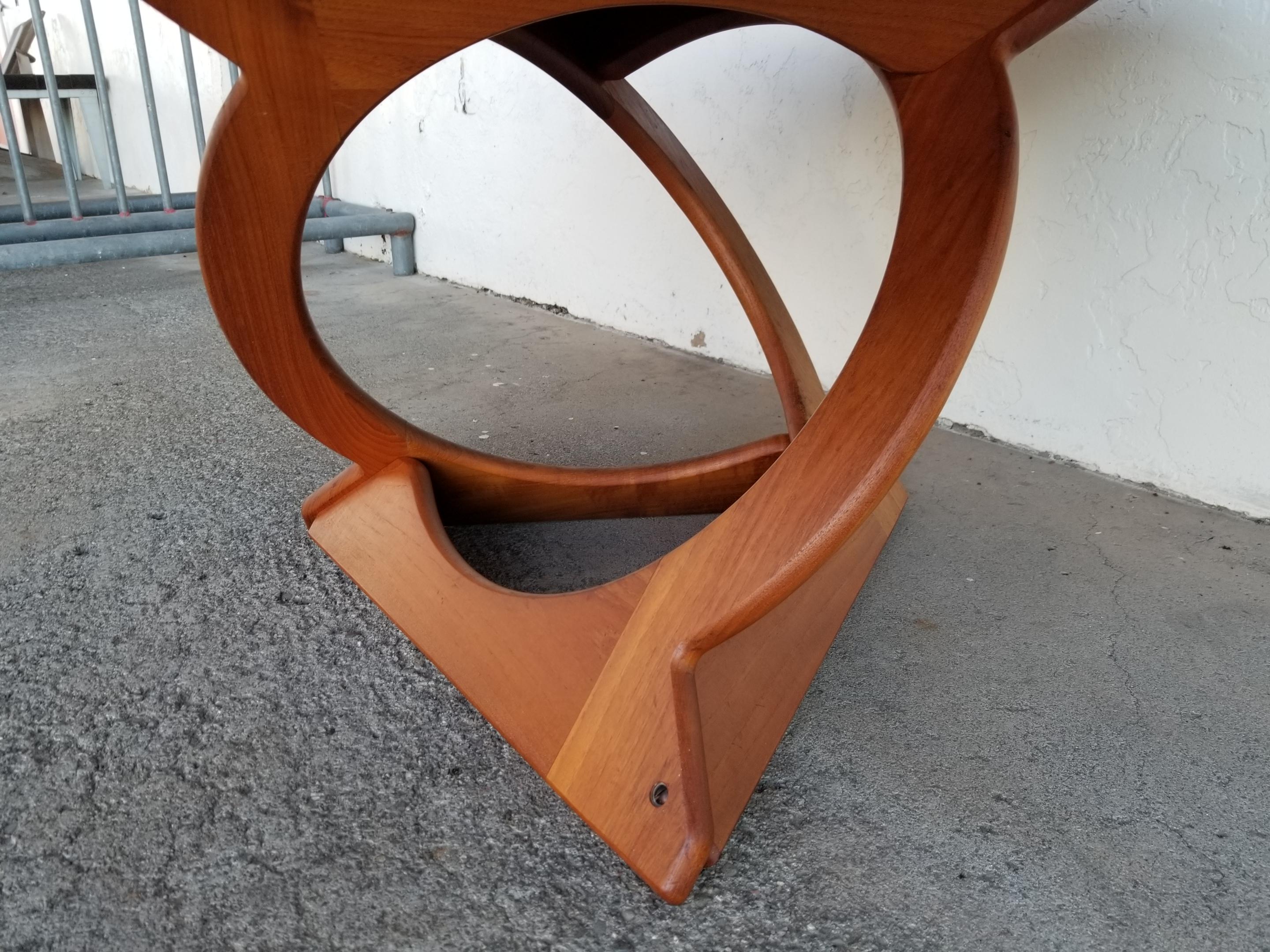 Impressive sculptural geometric base on this teak Danish modern circular table by Soren Georg Jensen. Solid teak base with sunburst teak veneer top surface. Top refinished in lacquer.