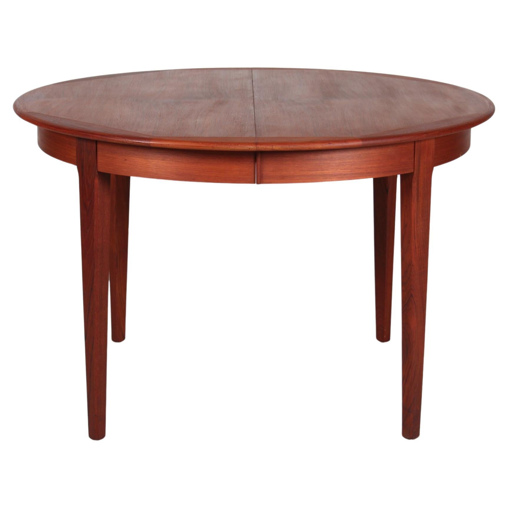 Danish Modern Round Dining Table of Teak with Leaves by Danish Cabinetmaker 70s