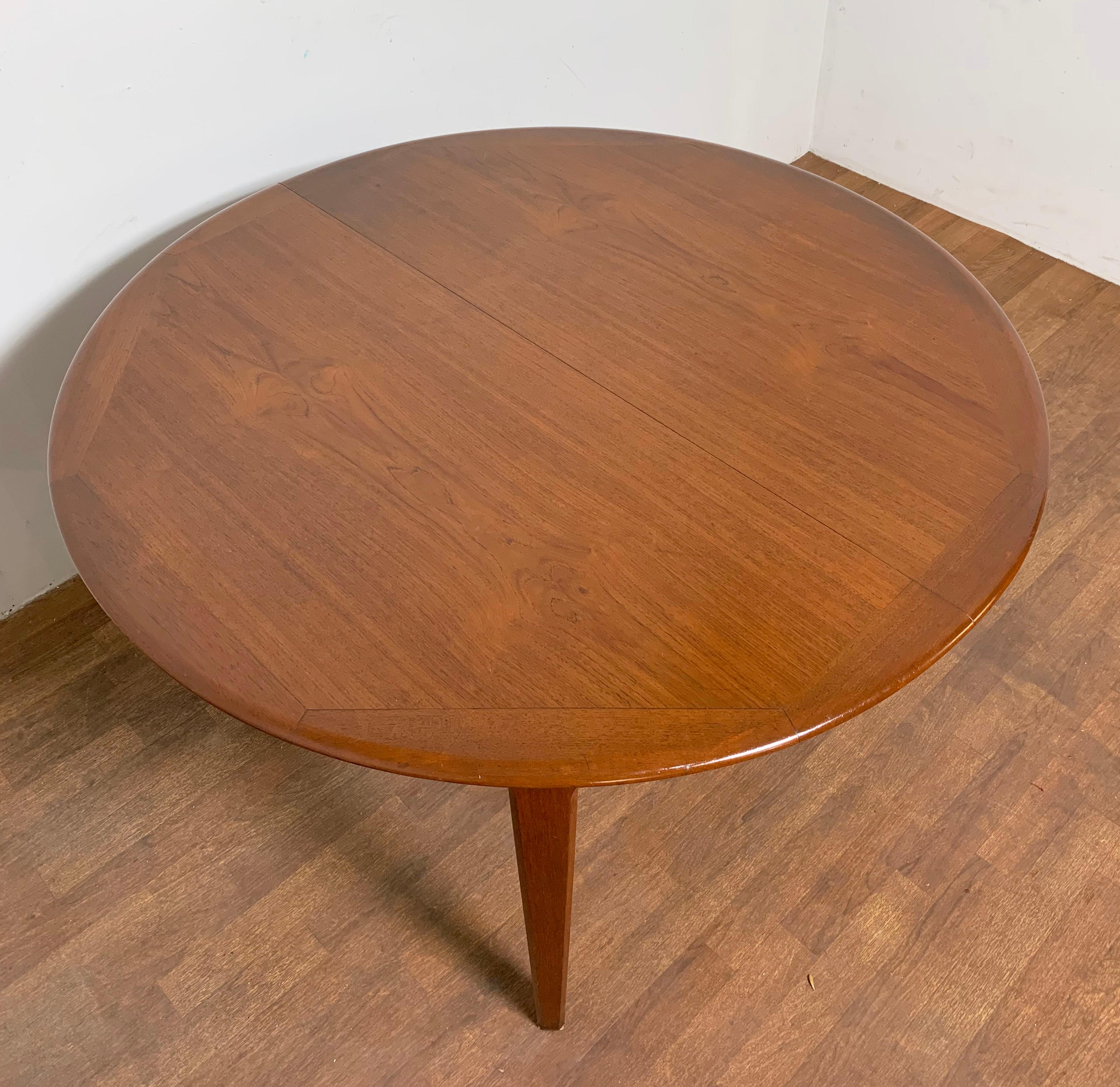 Danish round teak dining table with two leaves (19 5/8