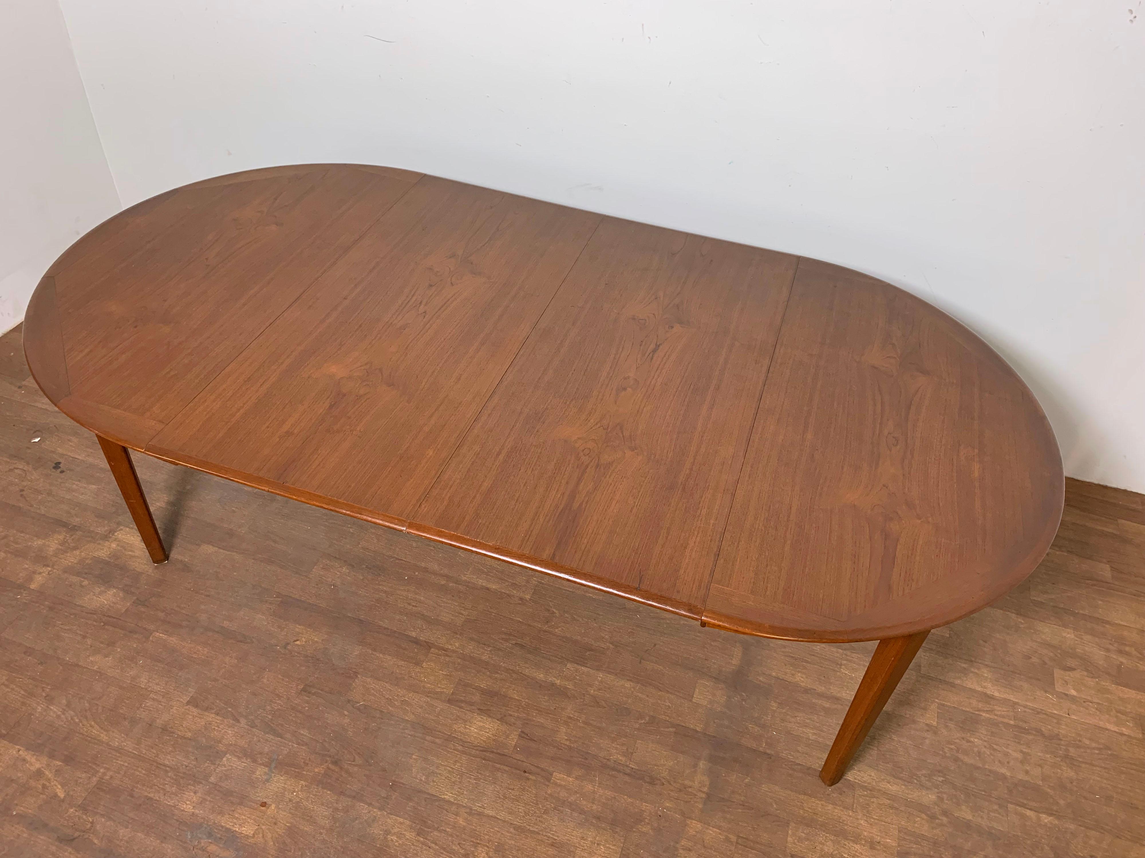 Danish Modern Round Teak Dining Table with Two Leaves, Circa 1960s In Good Condition In Peabody, MA