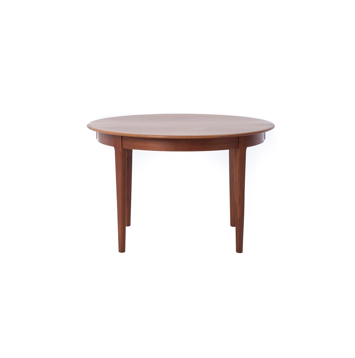 This Danish modern teak table has a lovely gem cut edge band detail. This table is an original midcentury table that would make a great breakfast table or dining table for a cozy spot. Made from old growth teak and hand finished with oil.