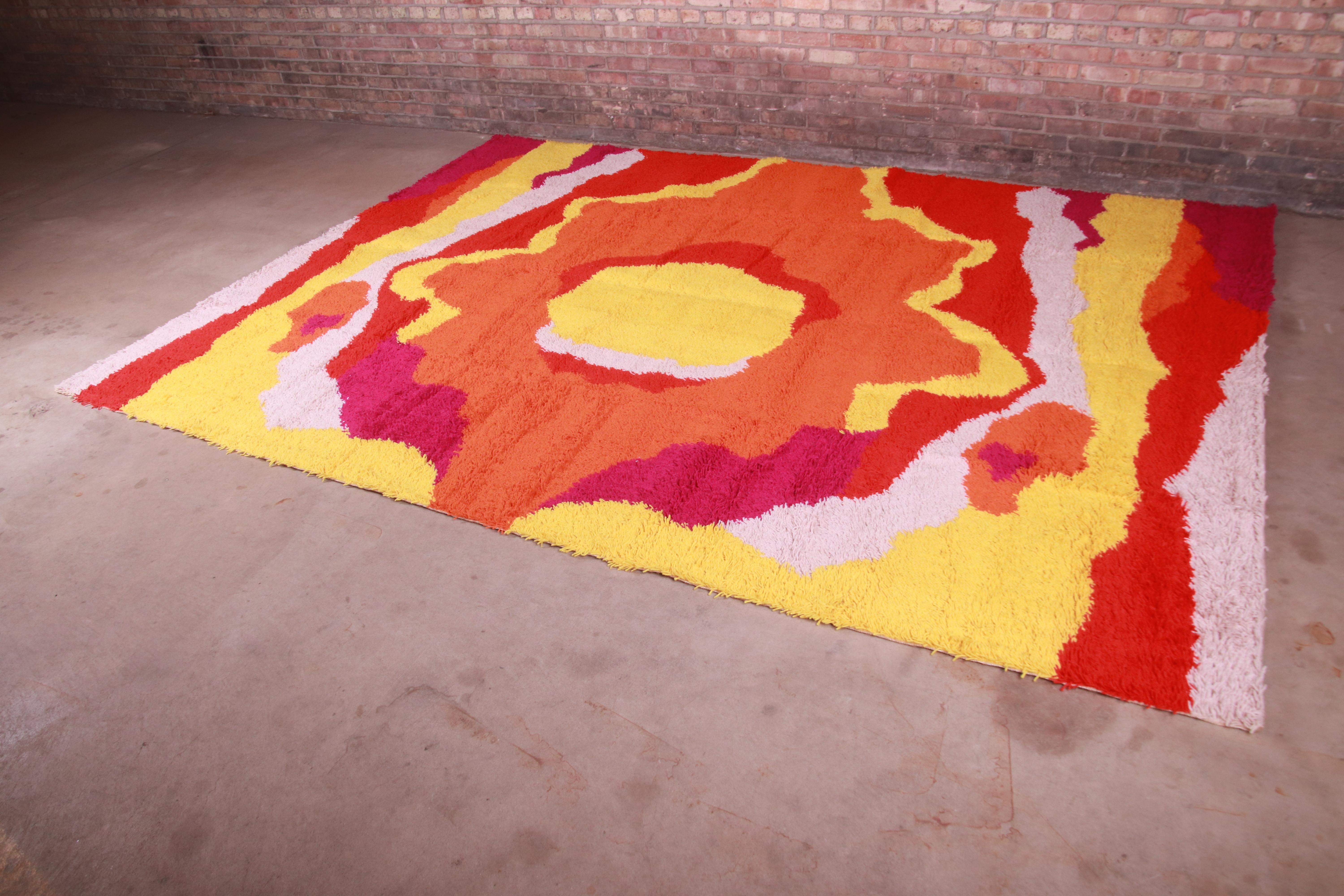 An outstanding mid-century Danish Modern Rya shag wool rug

By Galaxy Collection

Denmark, 1970s

Thick wool pile, with vibrant colors in yellow, red, orange, fuschia, and white.

Measures: 8'2