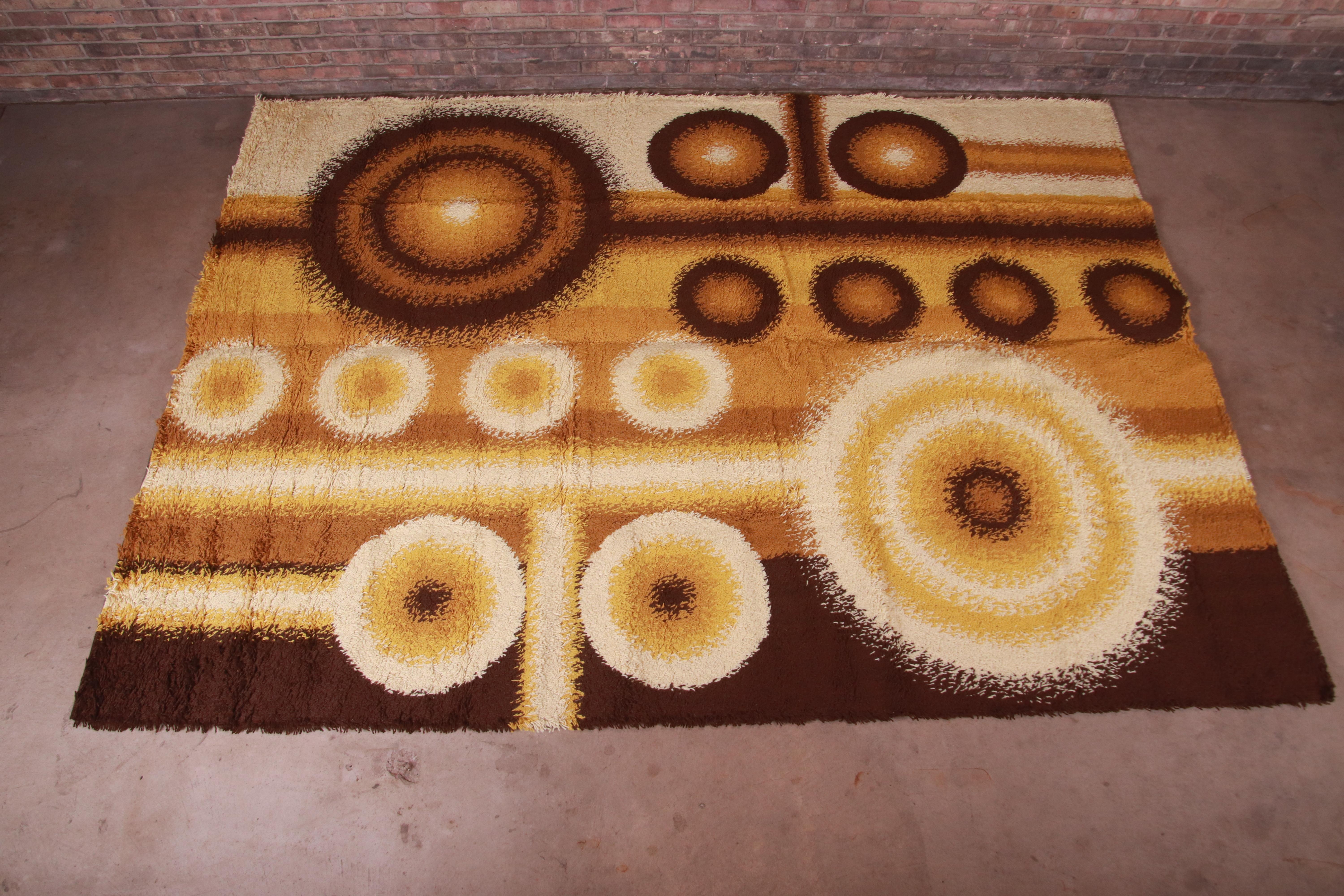 An outstanding mid-century Danish Modern Rya shag wool rug

By Dania Taepper

Denmark, 1970s

Thick wool pile, with earth tone colors in brown, gold, and ivory.

Measures: 8'2
