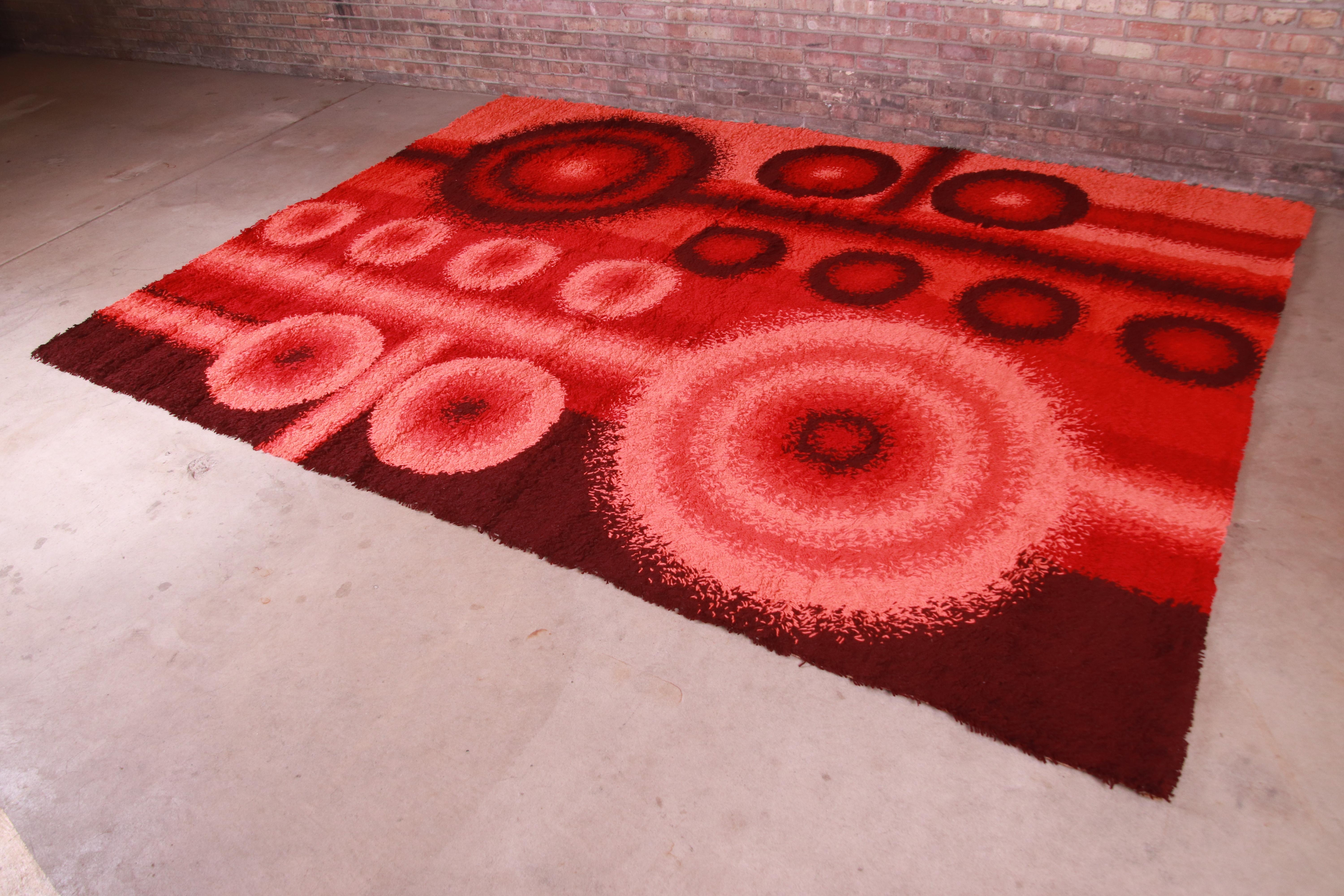 An outstanding mid-century Danish Modern Rya shag wool rug

By Dania Taepper

Denmark, 1970s

Thick wool pile, with vibrant colors in red, pink, and brown.

Measures: 8'2