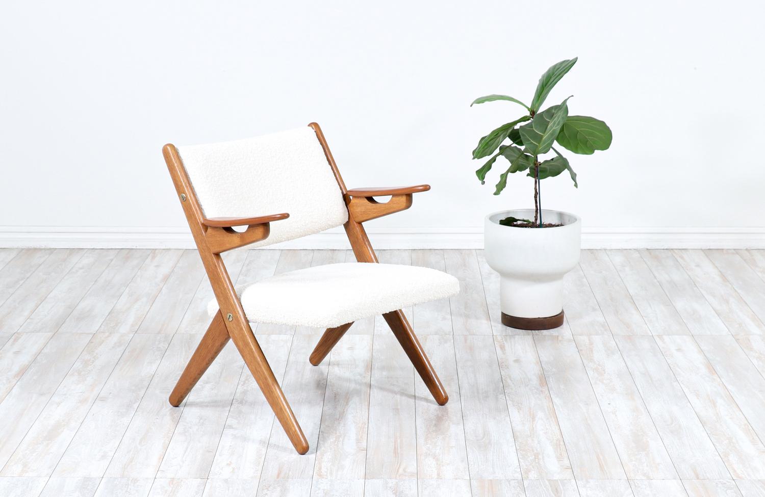 Danish Modern sculpted oak & teak arm chair by Arne-Hovmand Olsen.

________________________________________

Transforming a piece of Mid-Century Modern furniture is like bringing history back to life, and we take this journey with passion and