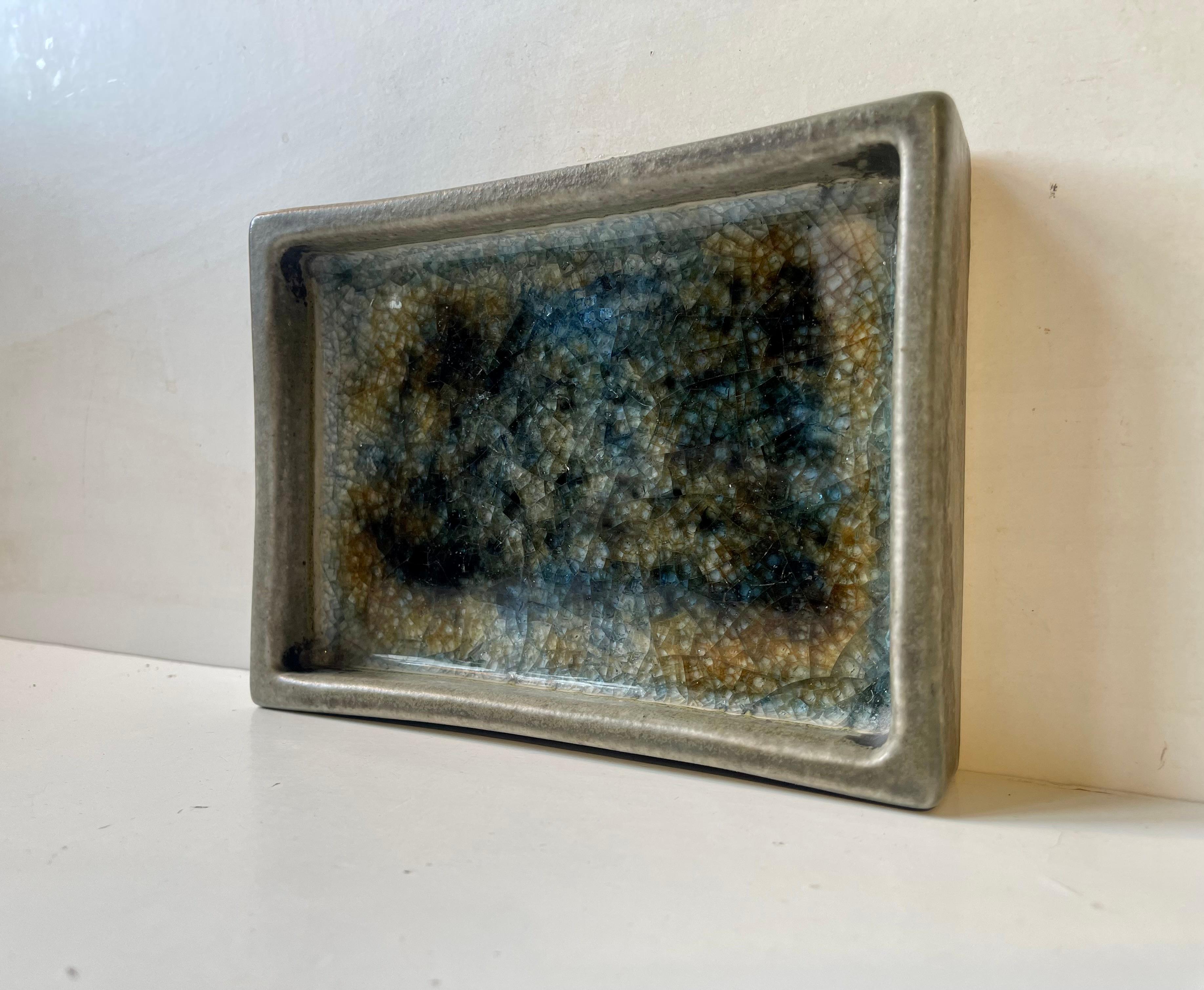 Japanese inspired Scandinavian rectangular stoneware dish by the Danish ceramist Gordon Petersen. This type is commonly referred to as a Sea of Glaze in Denmark due to the thick glossy layer of glaze to its show side. It is hand-signed by the