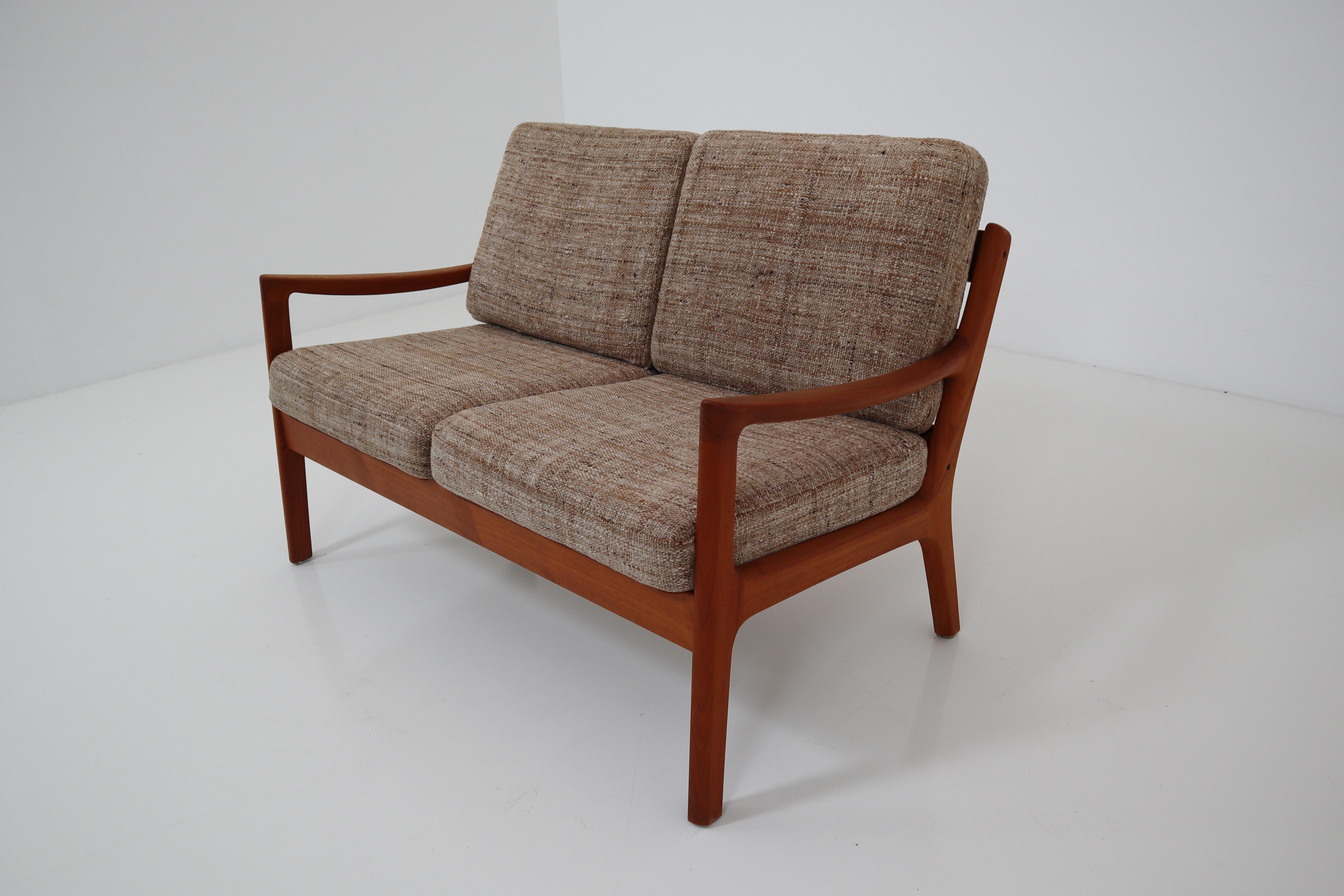 Danish modern senator loveseat by Ole Wanscher for Cado. Sturdy teak frame with loose cushions. Ready to reupholster in the fabric of your choice.
