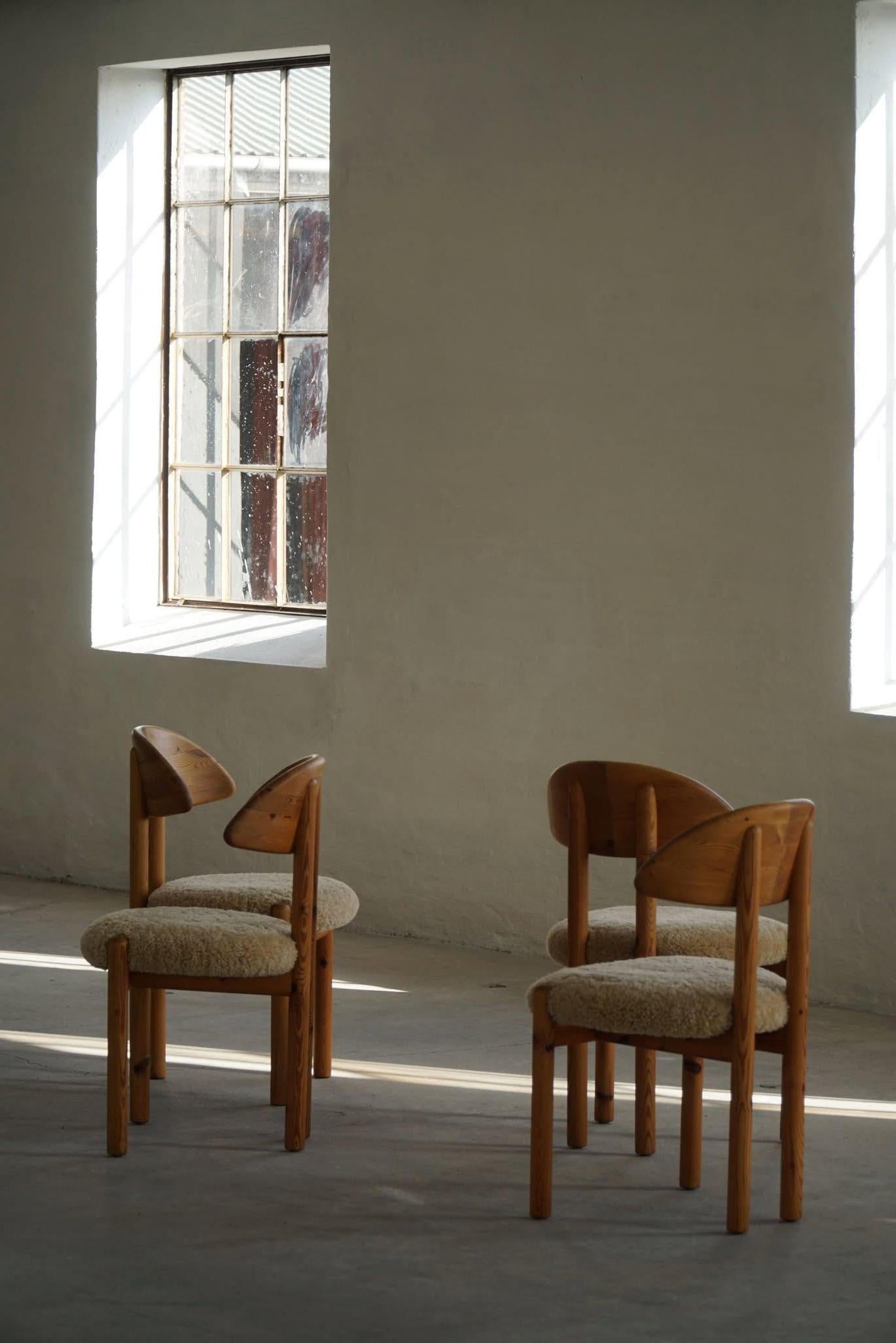 Set of 4 sculptural dining chairs in solid pine, reupholstered in a great shearling lambswool. Designed by Poul Hundevad for Vamdrup stolefabrik in the 1970s, stamped underneath. These brutalist chairs have a really strong impression that pair well