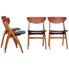 Danish Modern Set of Four Dining Room Chairs of Teak and Oak with Black Seats