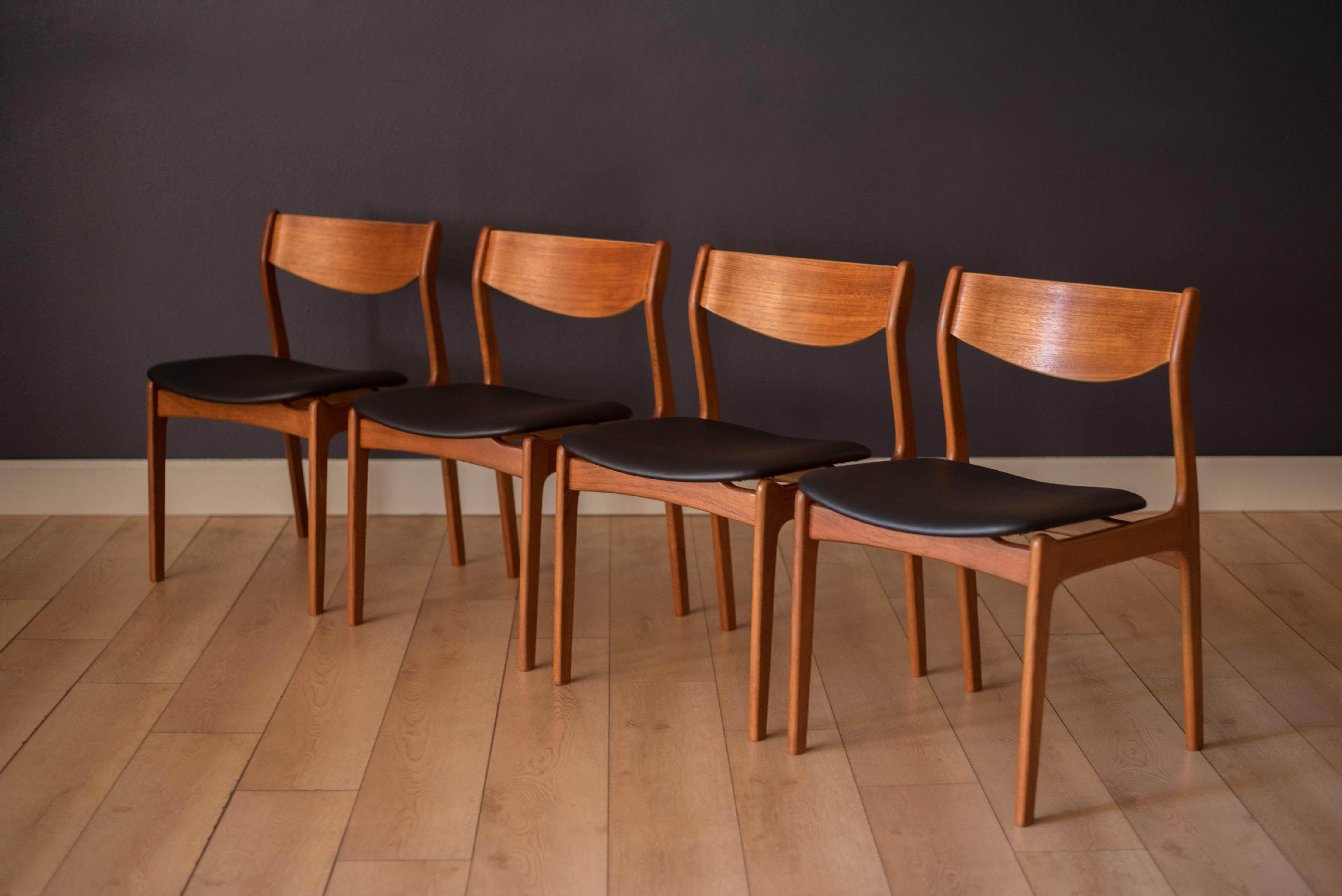 Mid-Century Modern dining chairs designed by P.E. Jorgensen for Farso Stolefabrik, Denmark circa 1960's. This set features unique floating seats and a sculptural teak frame with contrasting birch accents. Includes four side chairs that have been
