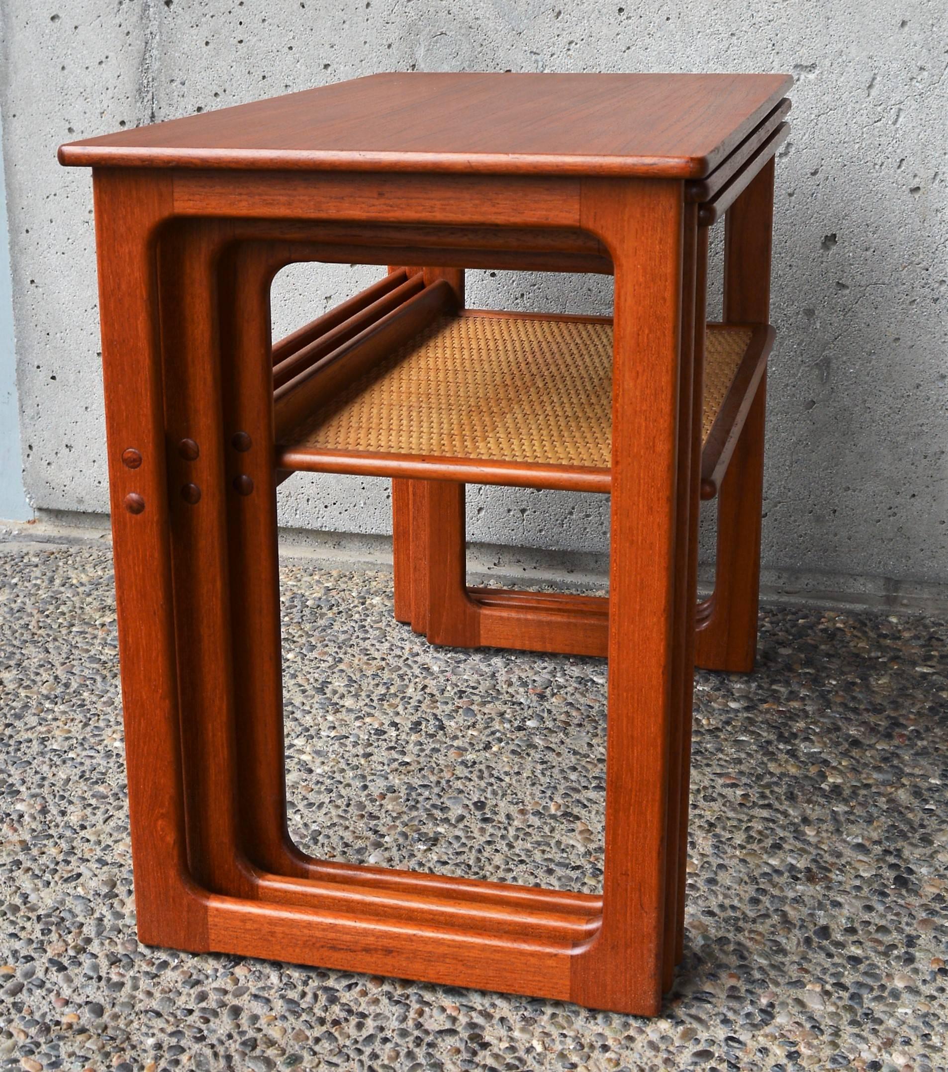 Mid-20th Century Danish Modern Set of Three Larger Teak Nesting Tables with a Woven Cane Shelf