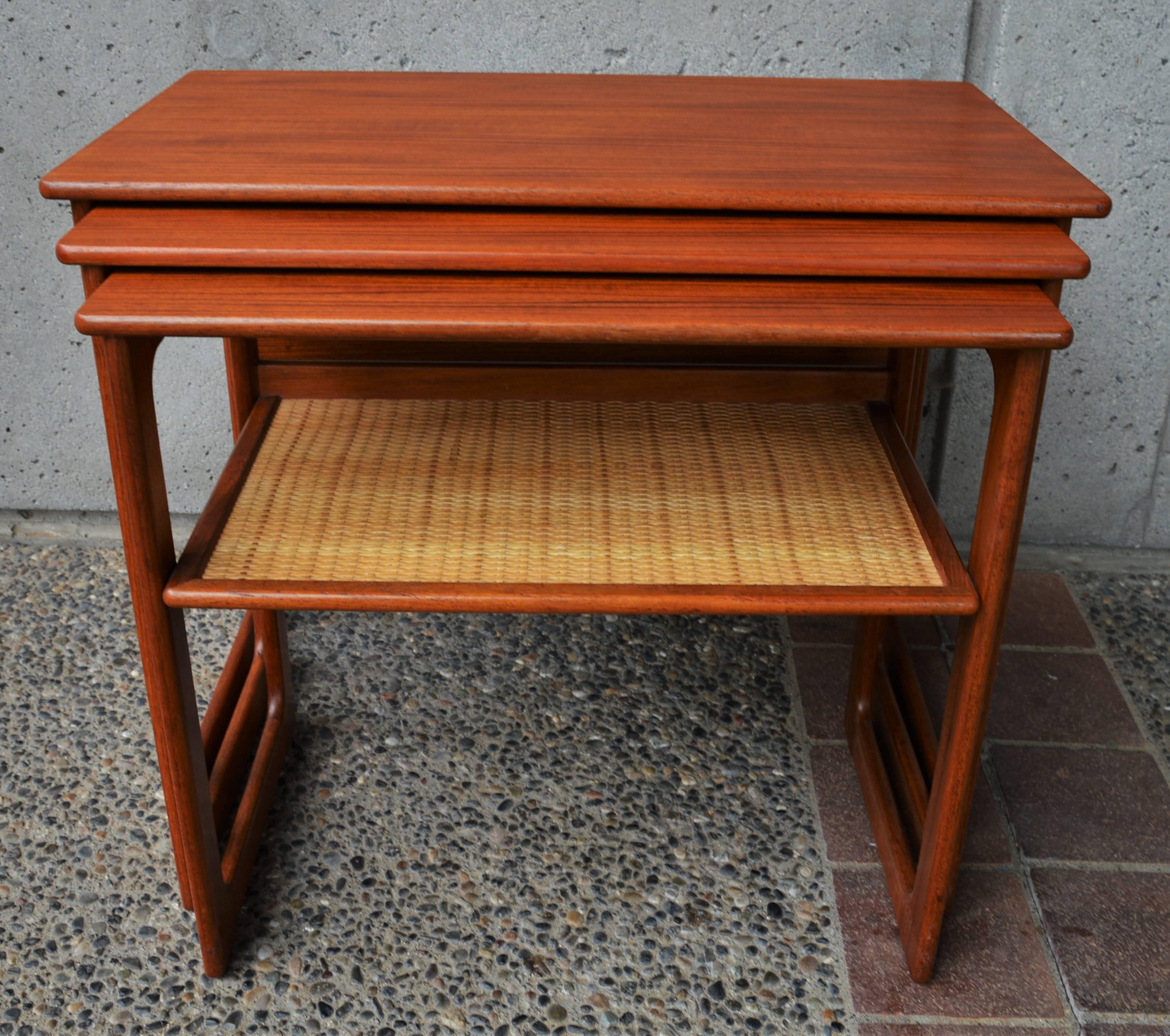 Danish Modern Set of Three Larger Teak Nesting Tables with a Woven Cane Shelf 1