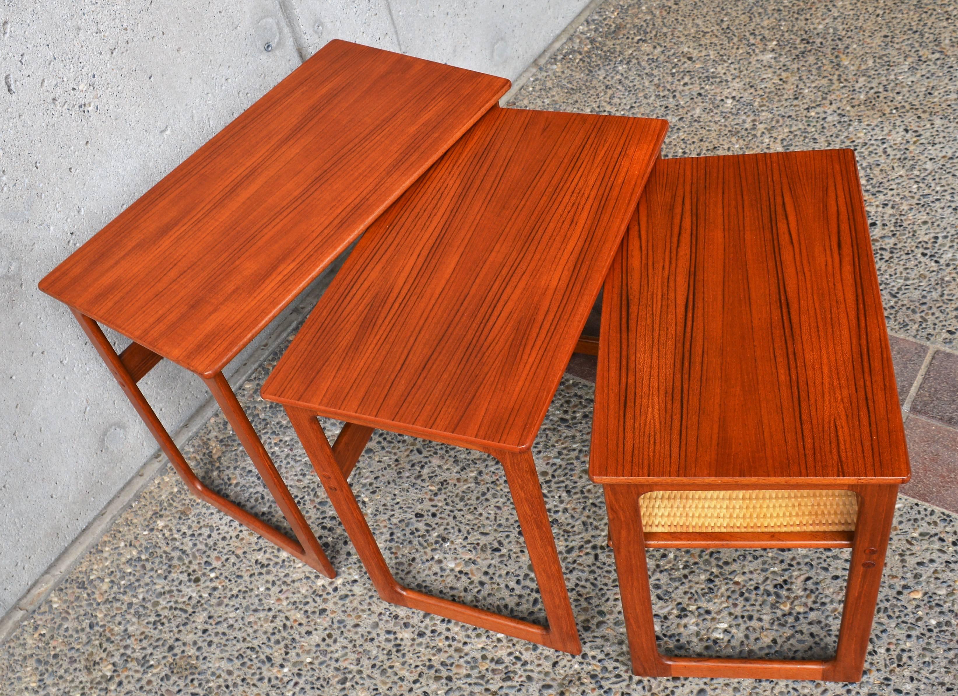 Danish Modern Set of Three Larger Teak Nesting Tables with a Woven Cane Shelf 2