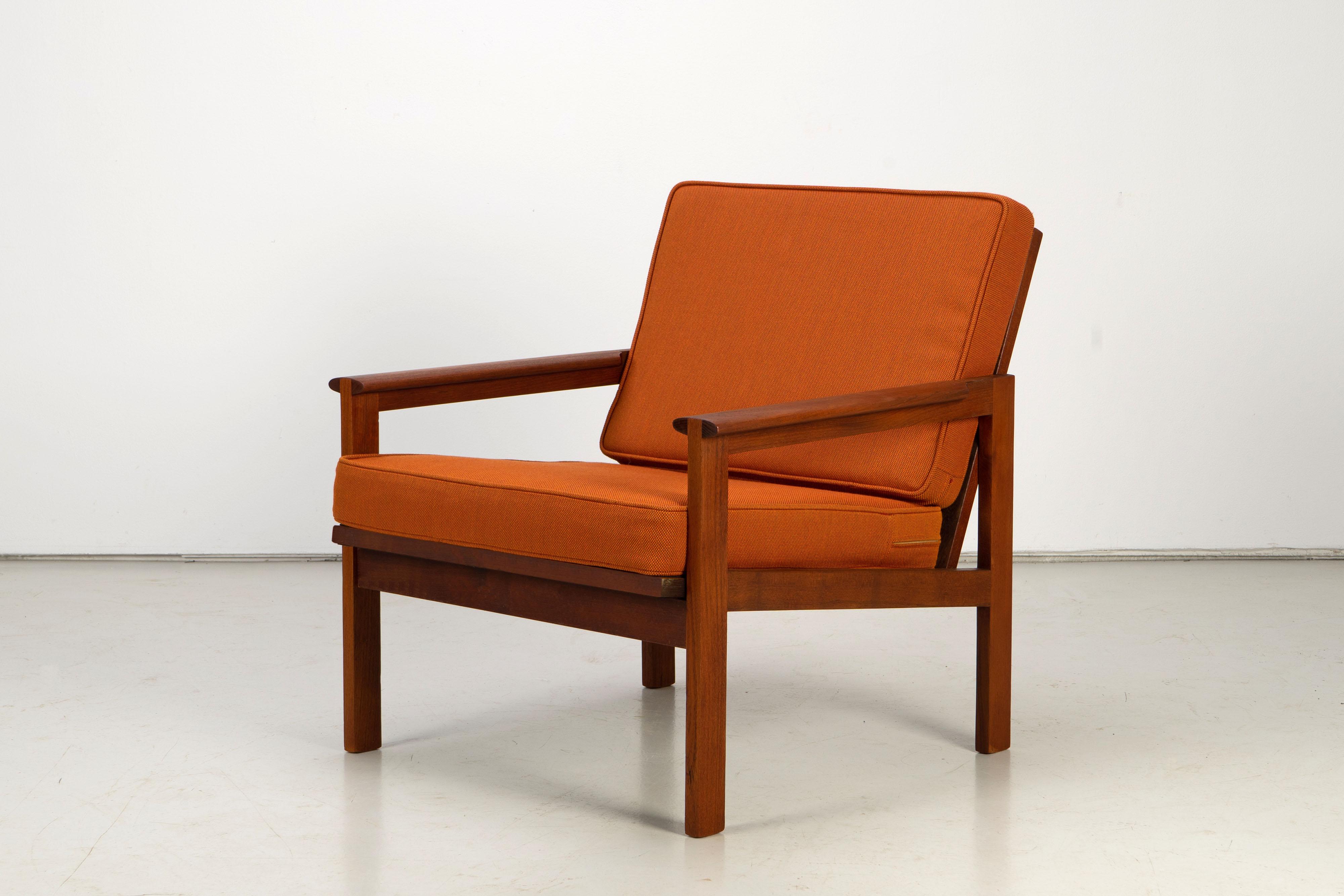 Set of two Danish Modern teak wood lounge chairs by Illum Wikkelsø. The chairs have been newly upholstered with a fabric by Kvadrat.