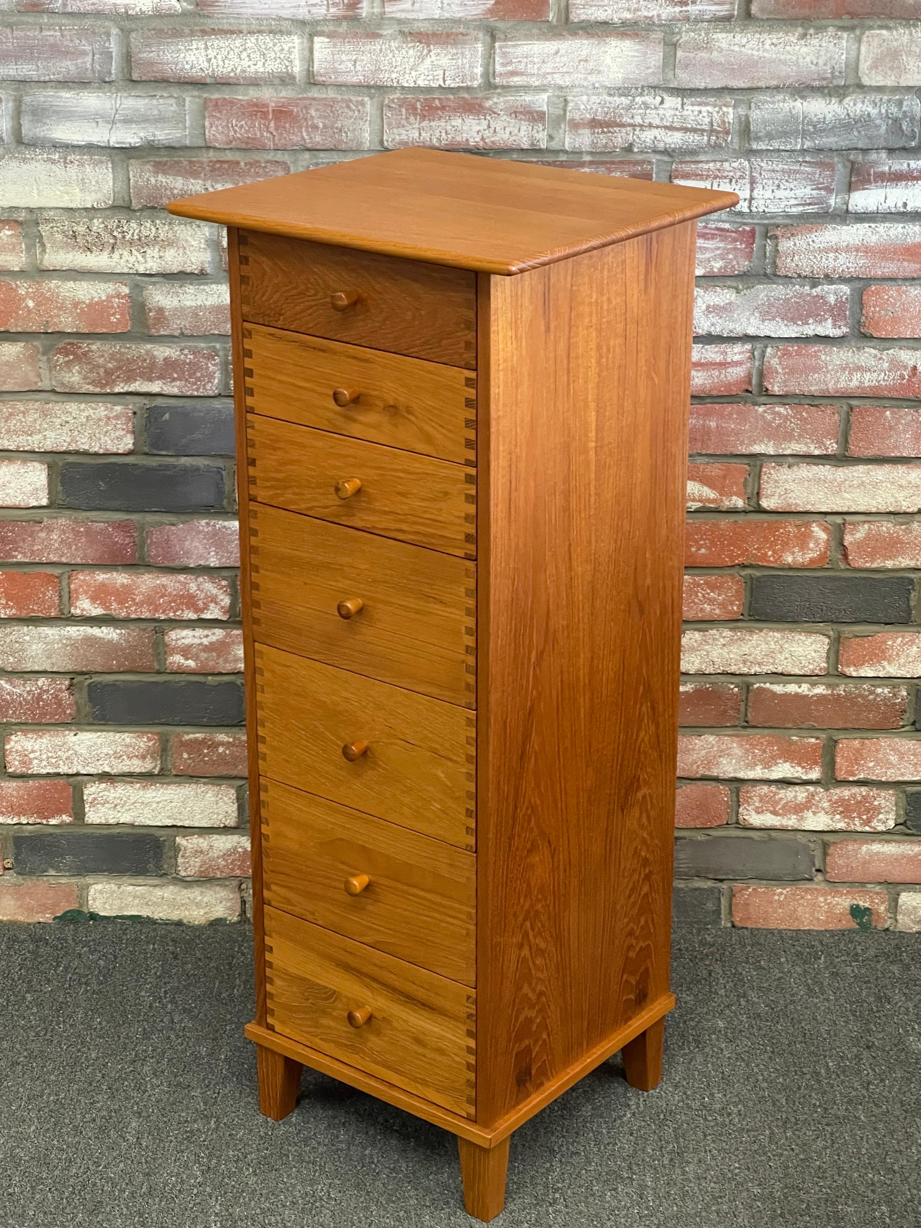 A gorgeous Danish modern seven-drawer teak lingerie chest by Aksel Kjersgaard, circa 1980s. The chest is exquisite; the quality is top notch with all solid wood dovetailed drawers and a finished back. The top has an overhang and beveled edge and the