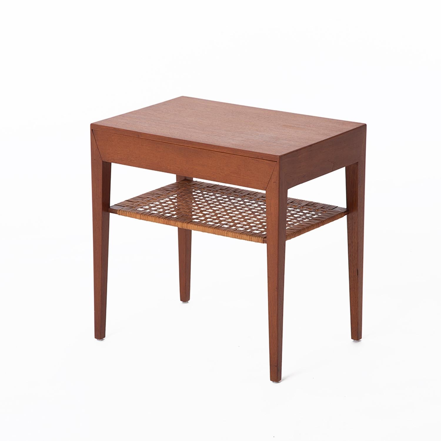 Danish modern teak occasional table with single drawer and caned shelf. Design by Severin Hansen for Haslev Mobelsnedkeri. 


Professional, skilled furniture restoration is an integral part of what we do every day. Our goal is to provide